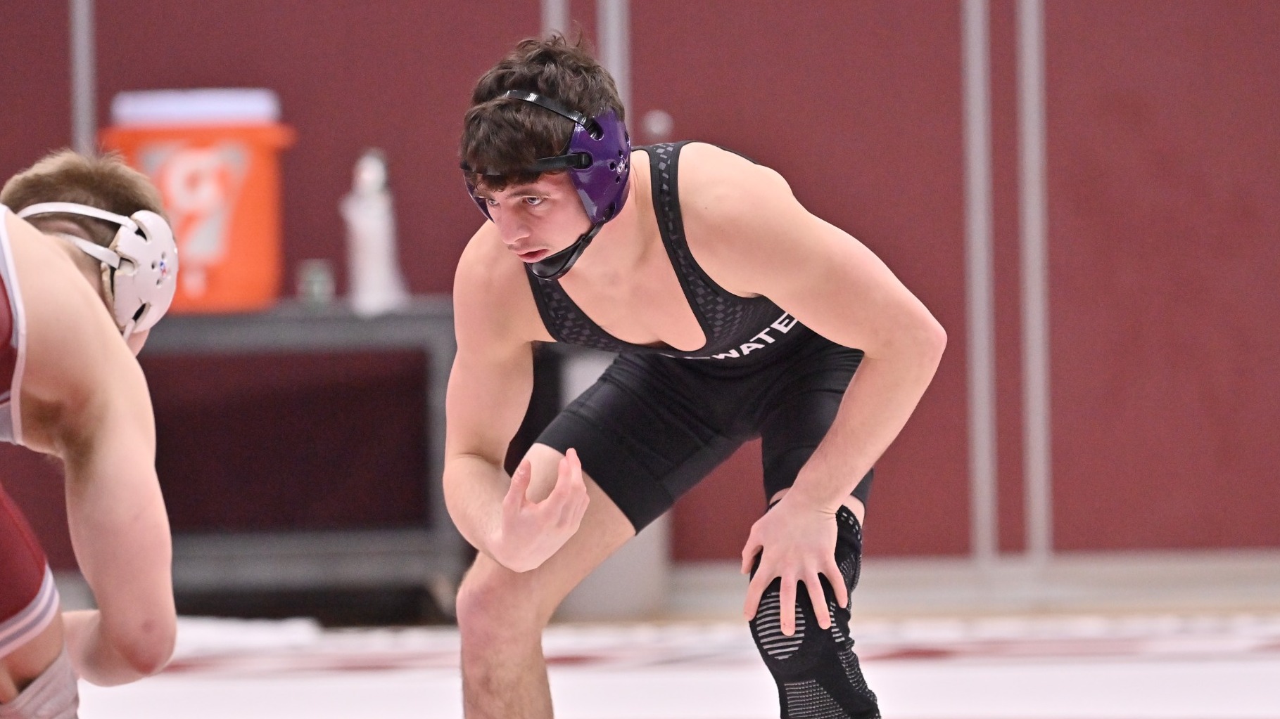 Justin Fortugno wrestles against UWL