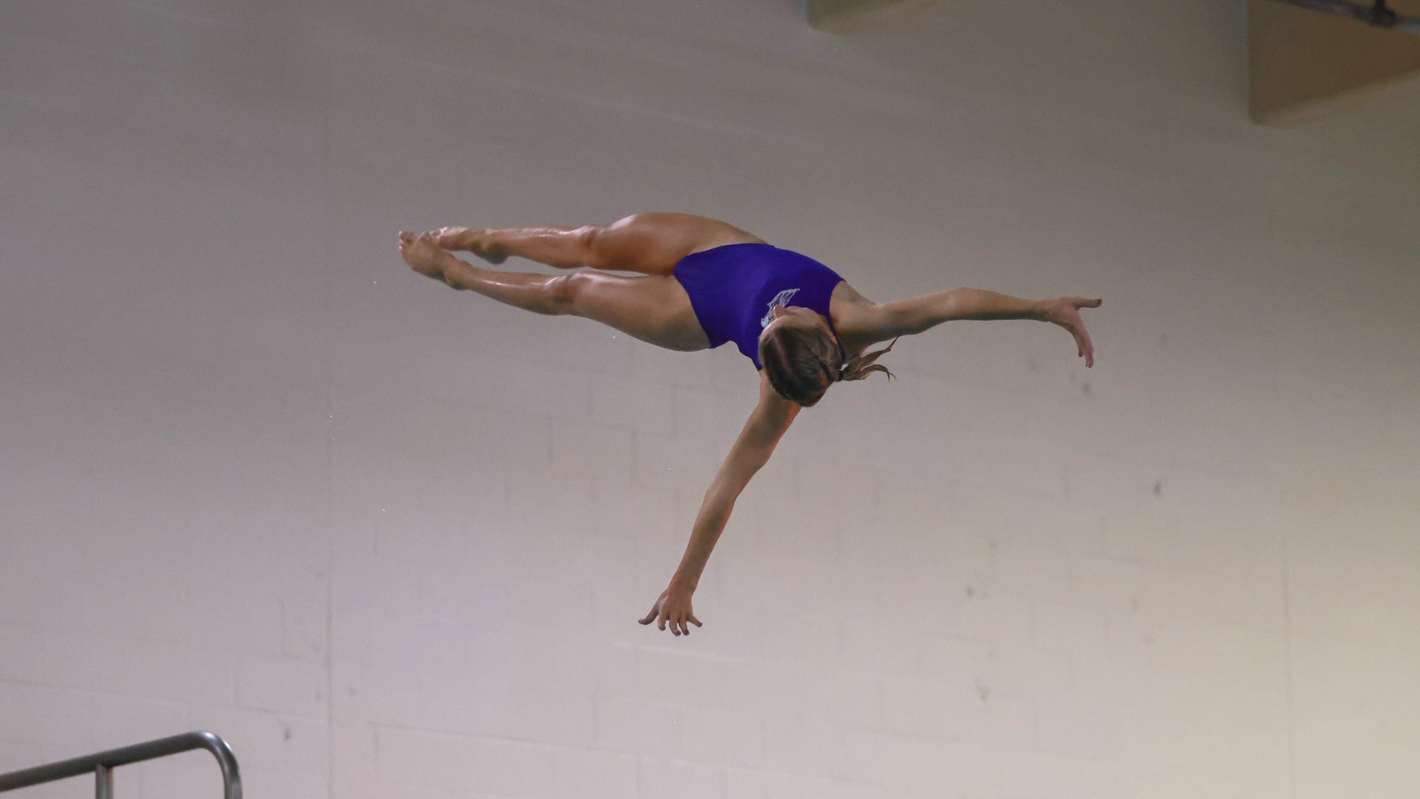 Warhawk women's diver mid-dive