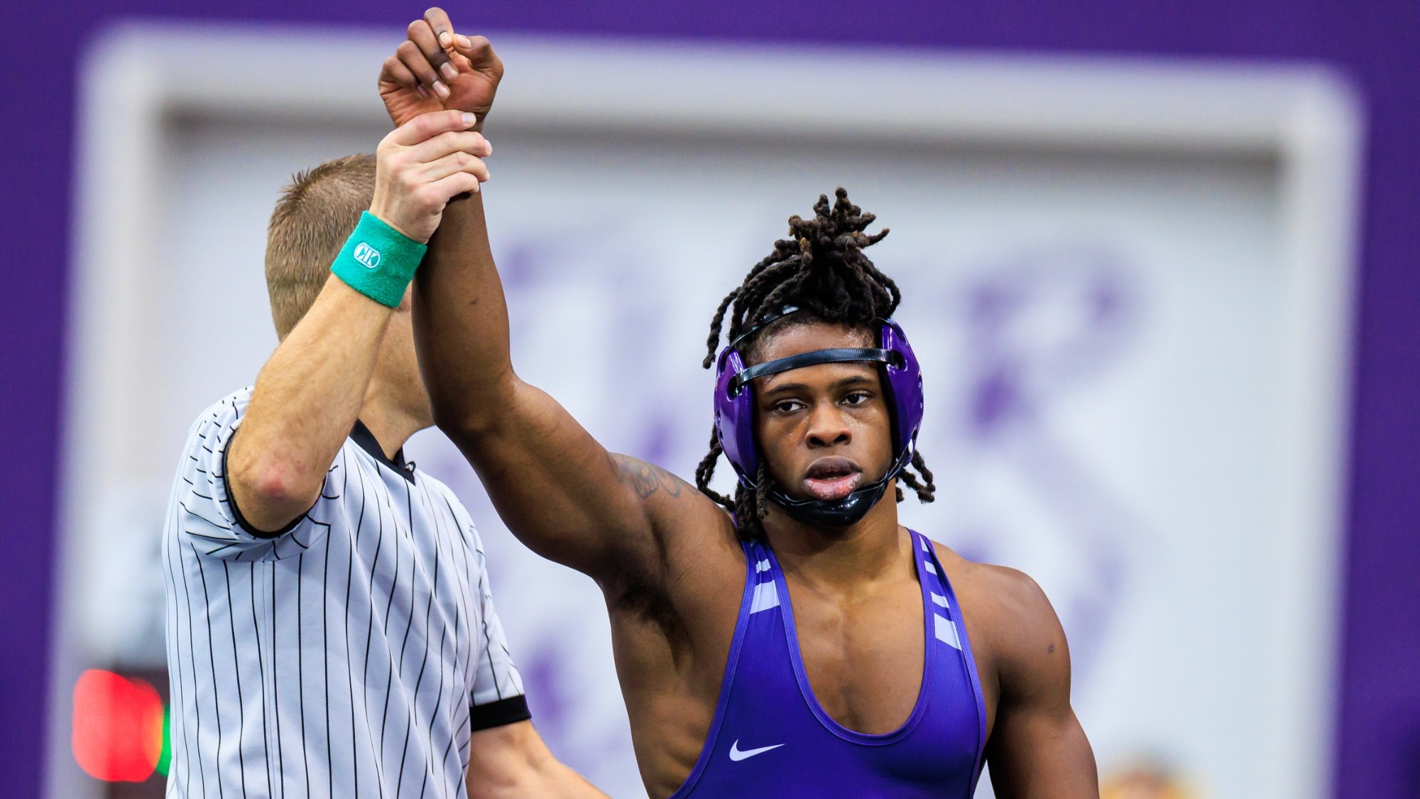 Jermaine Butler's hand is raised by the ref after winning a bout