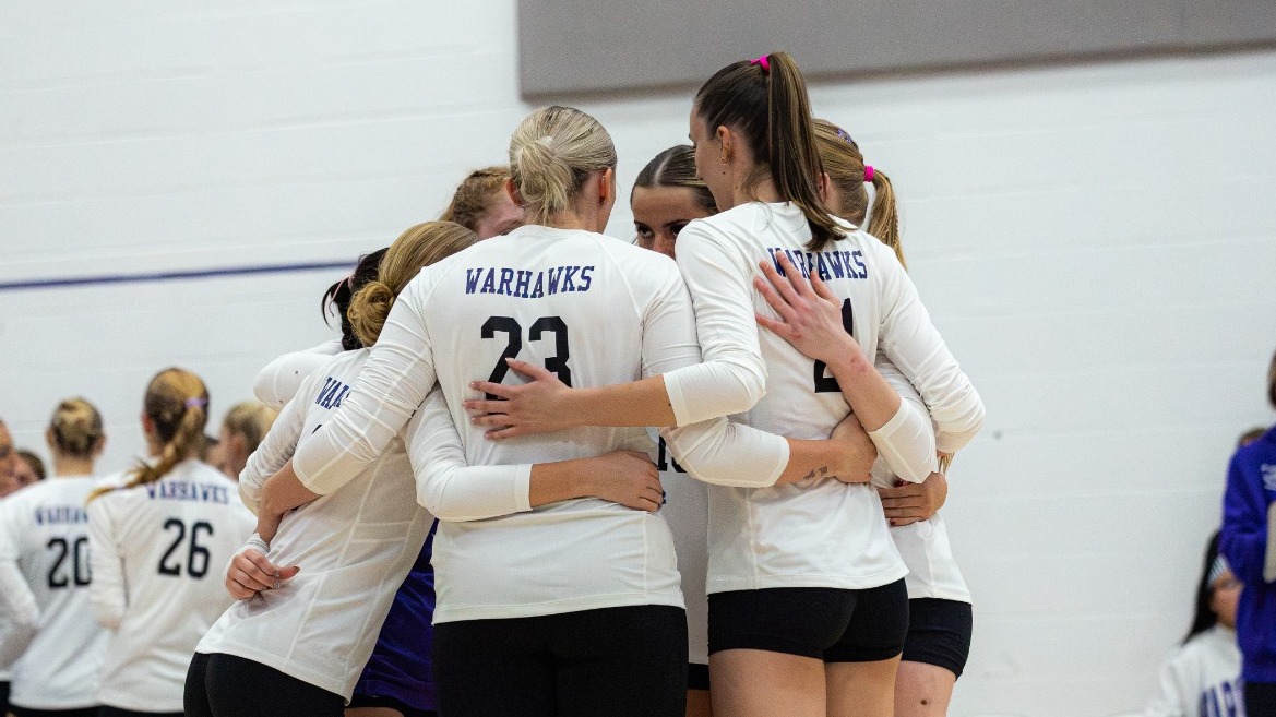 Warhawks huddle after a point