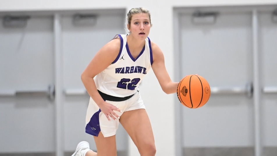 Cam Nies brings the ball up the court