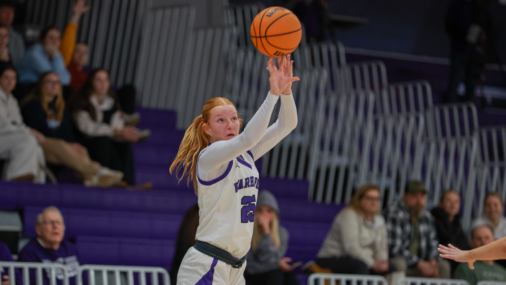 Lily Newton shoots a three against UW-Stevens Point