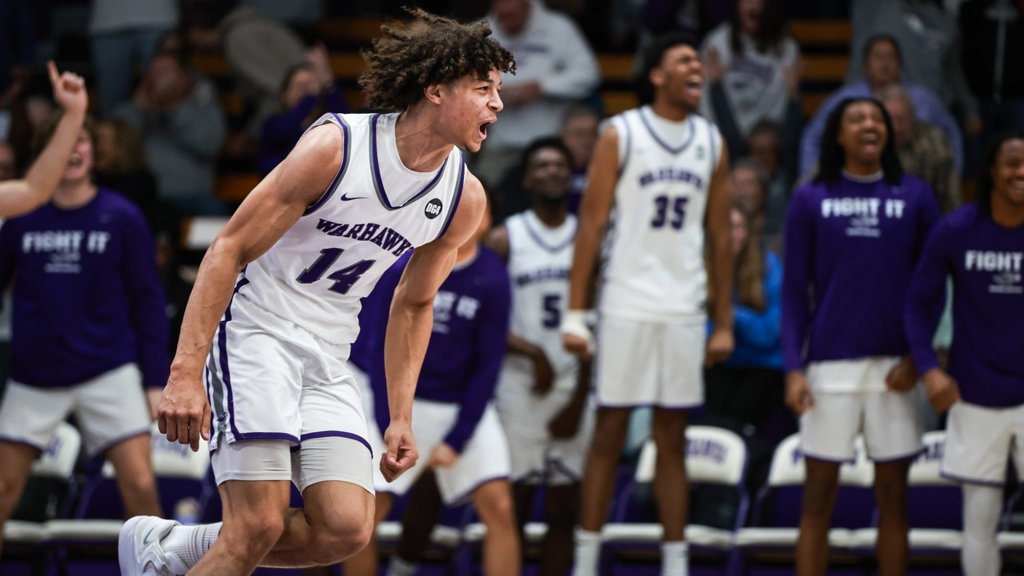 Tyshawn Teagu-Johnson celebrates after dunk