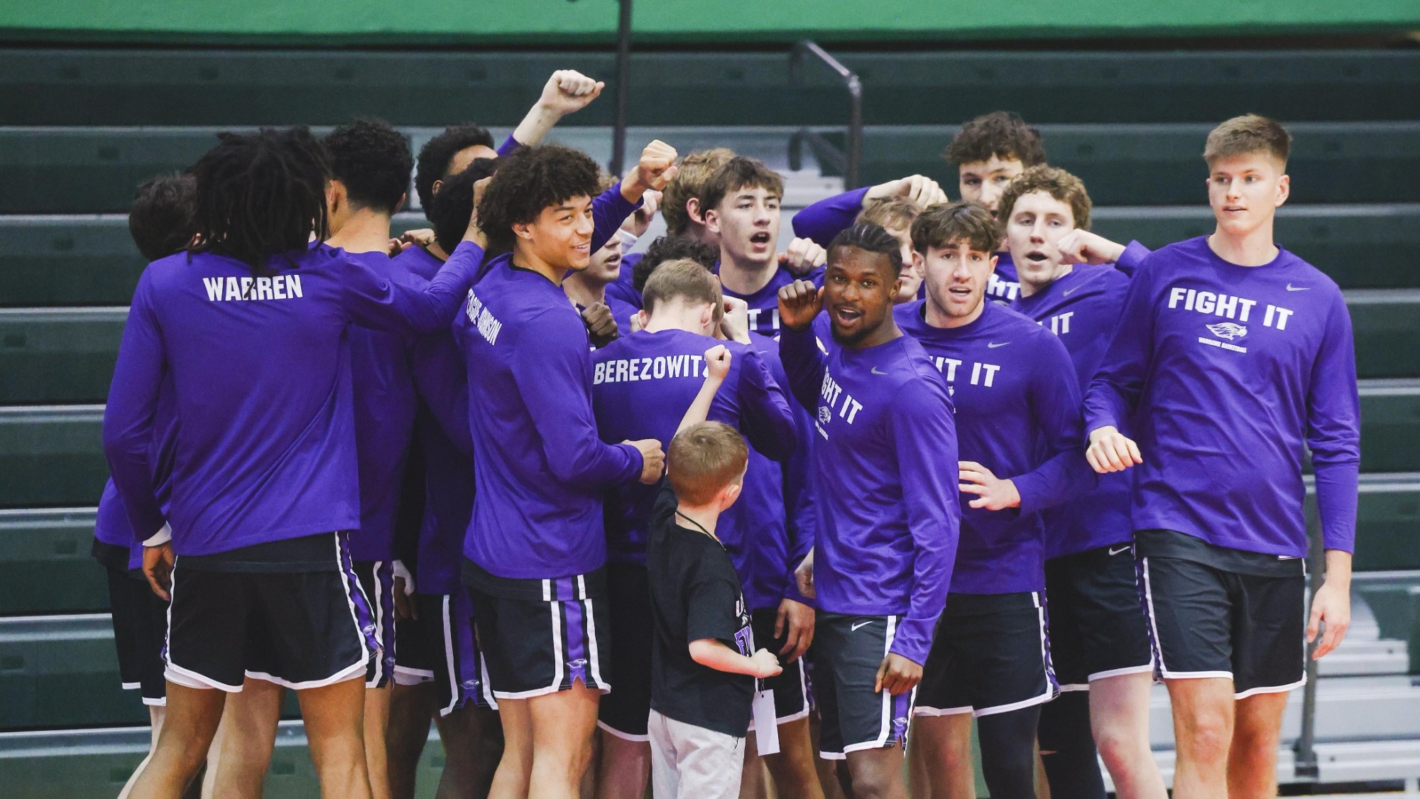 MBB huddle before game against WashU in NCAAT