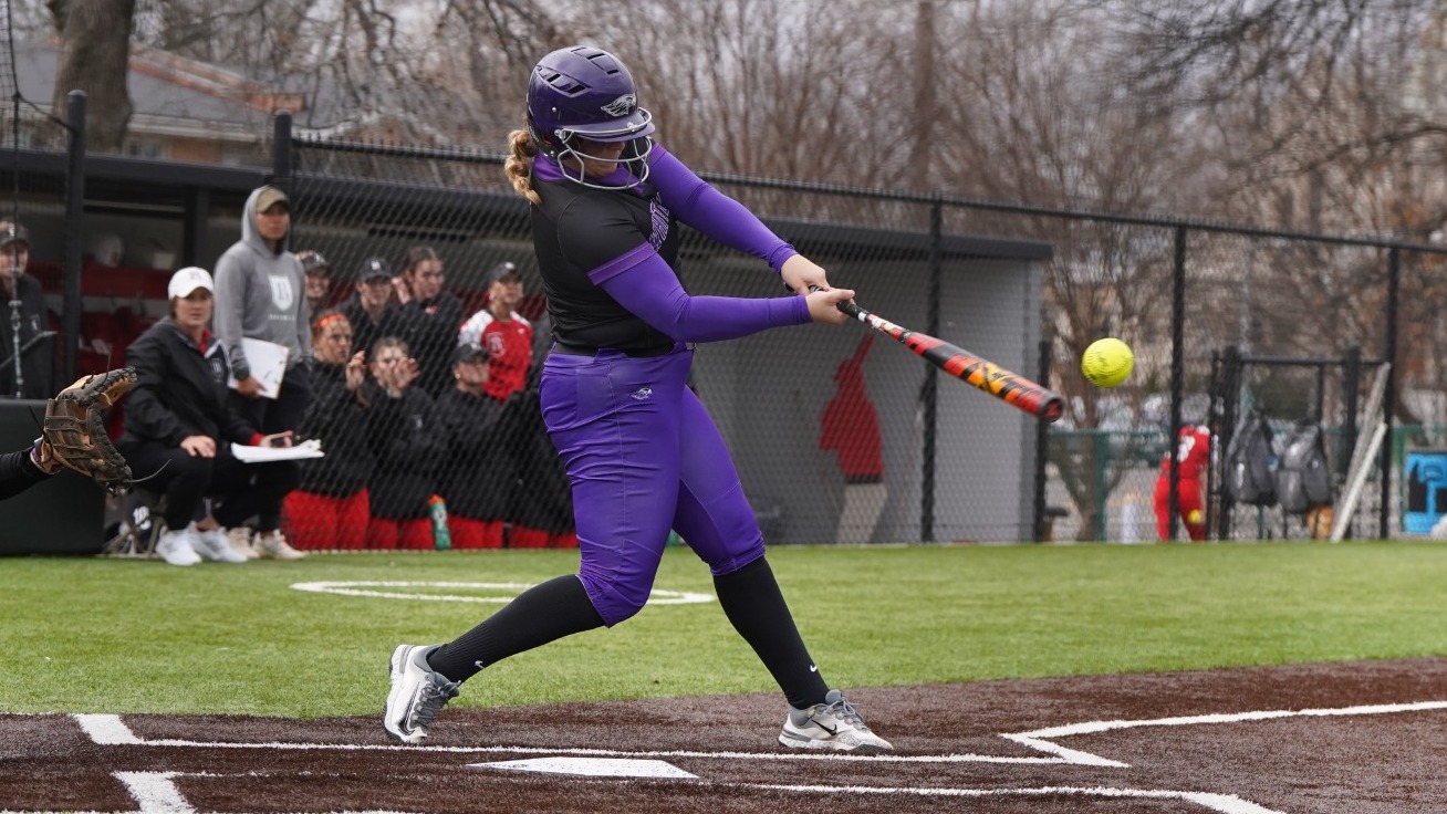 Emma Giese hits a ball against Rhodes College