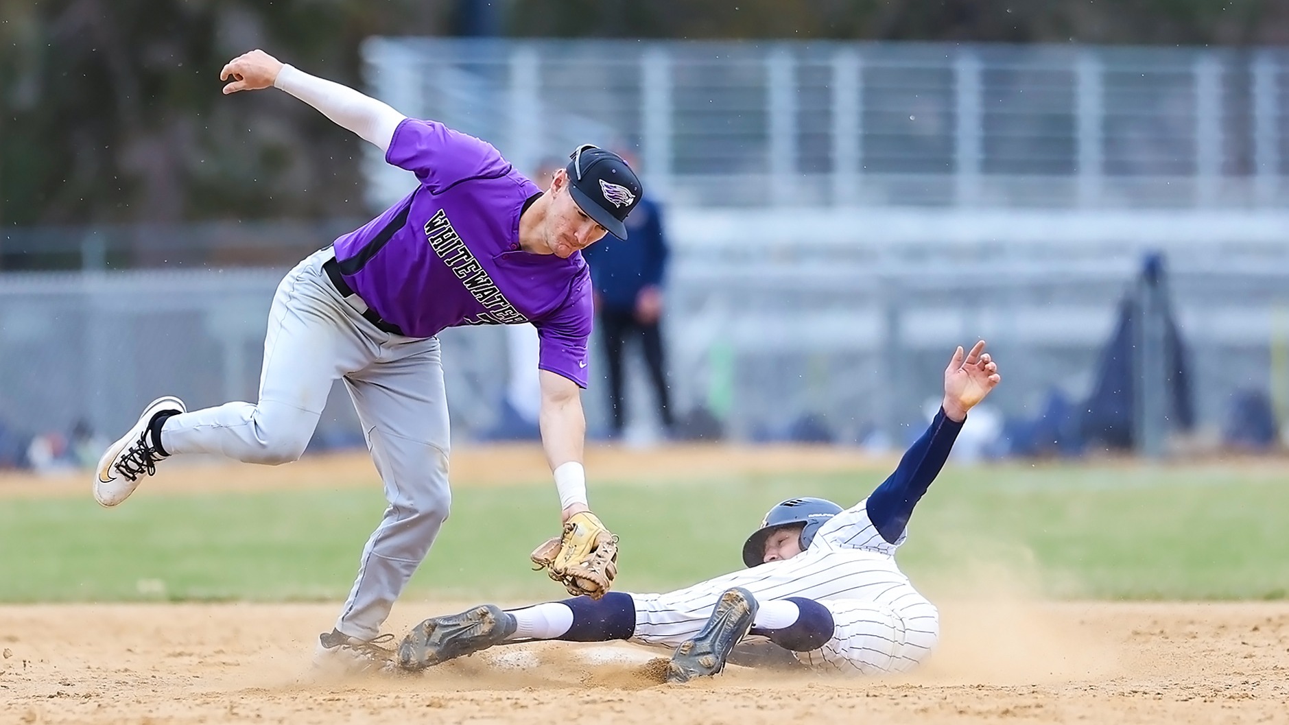 Andy Thies tags UWEC runner at second