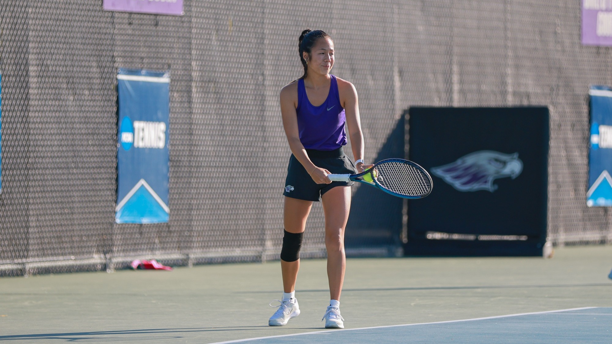 Gracie Ha preparing for serve