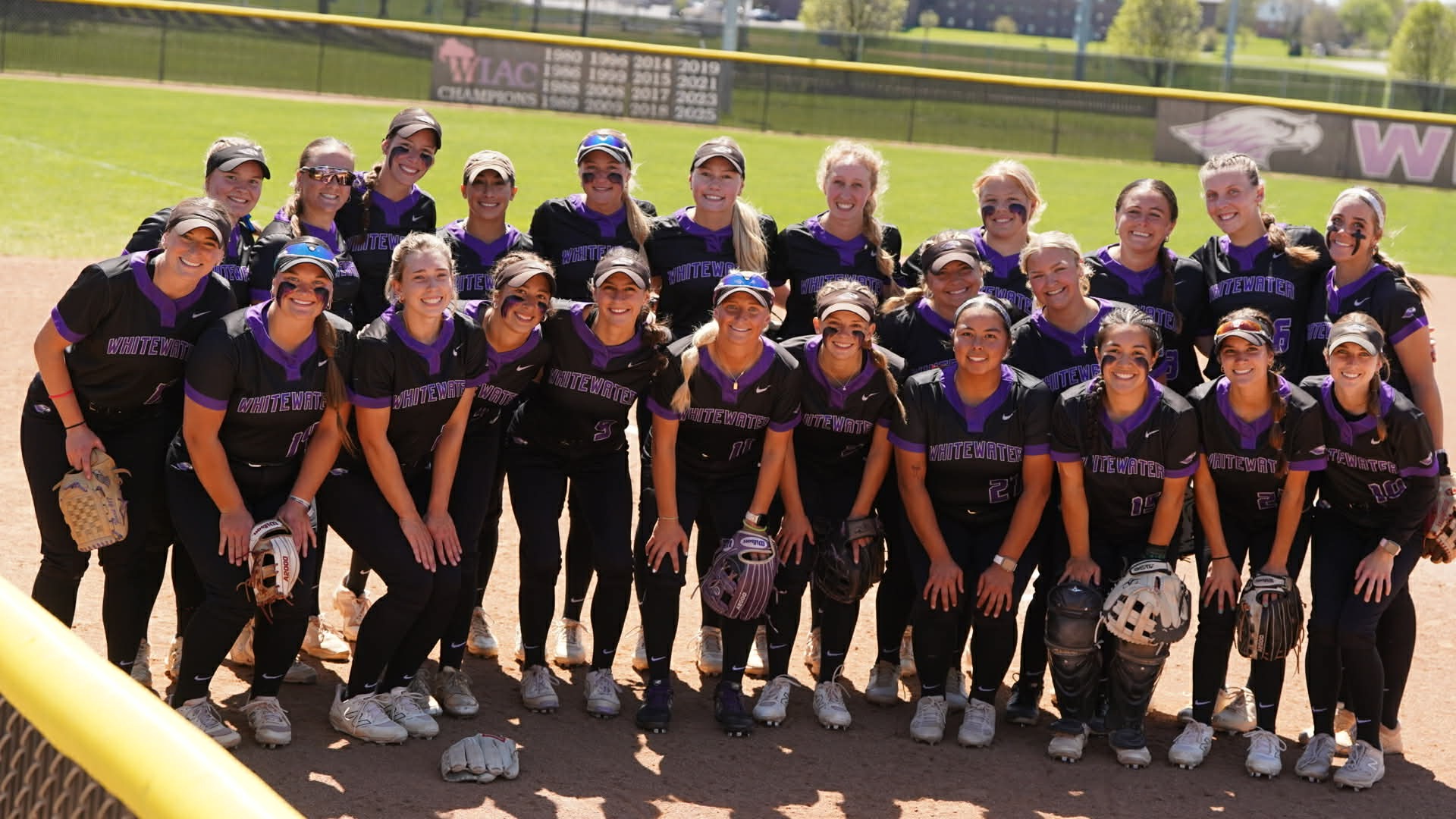 Warhawks pose as a team before senior day