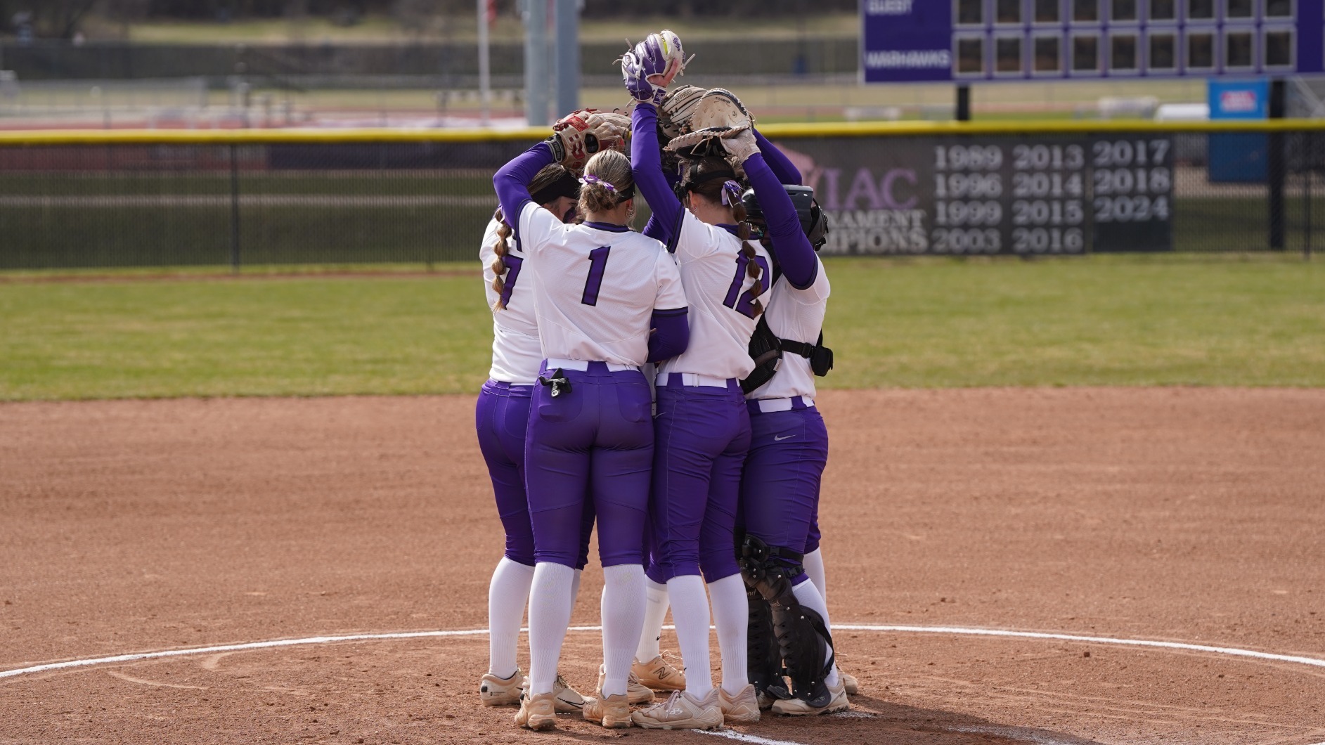 Warhawk infielders gather in the circle before the start of an inning