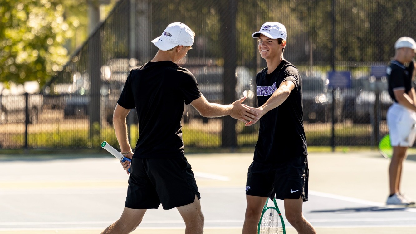 Men's Tennis Doubles Pair celebrate