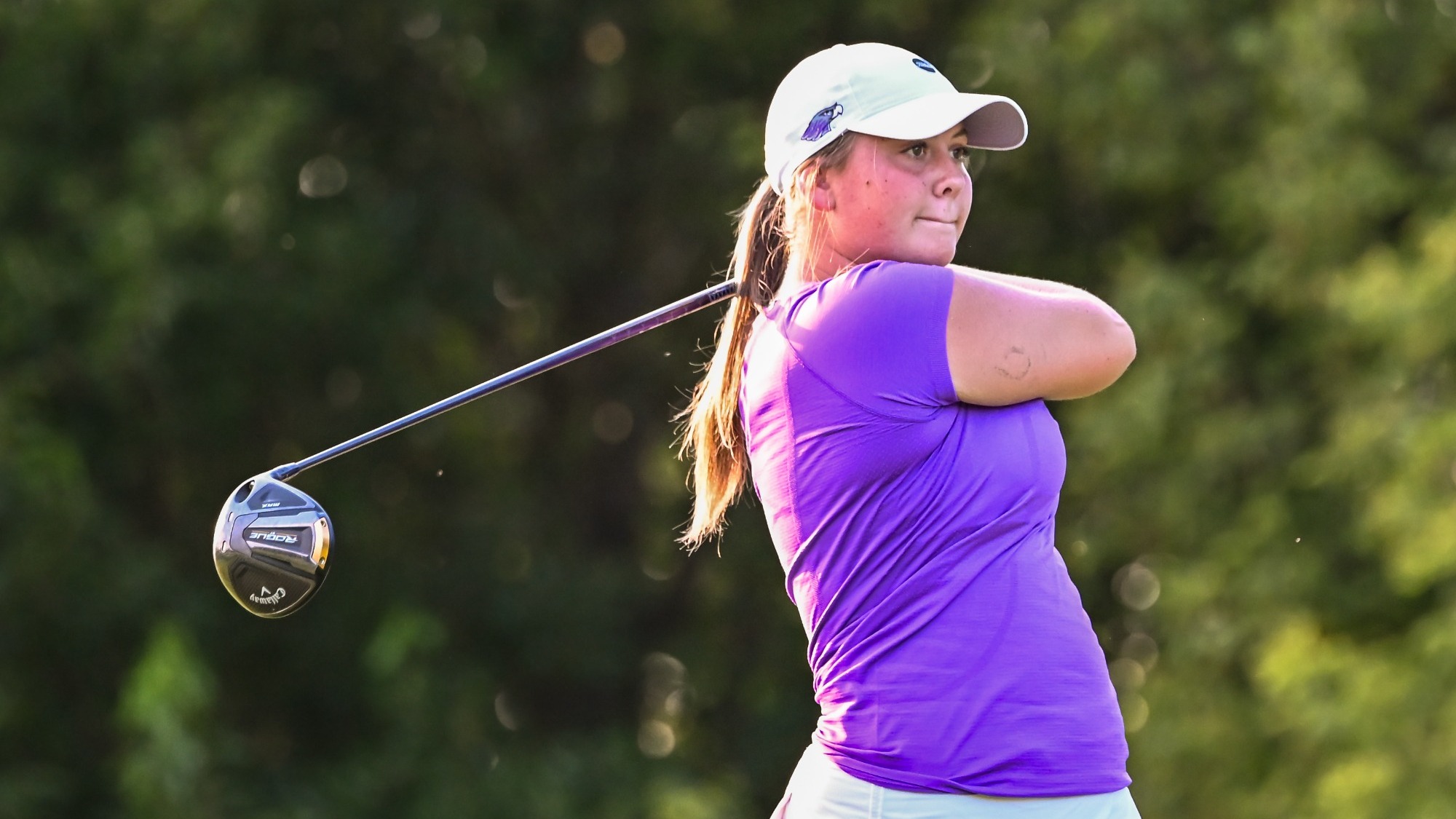 Delainey Halverson drives a ball
