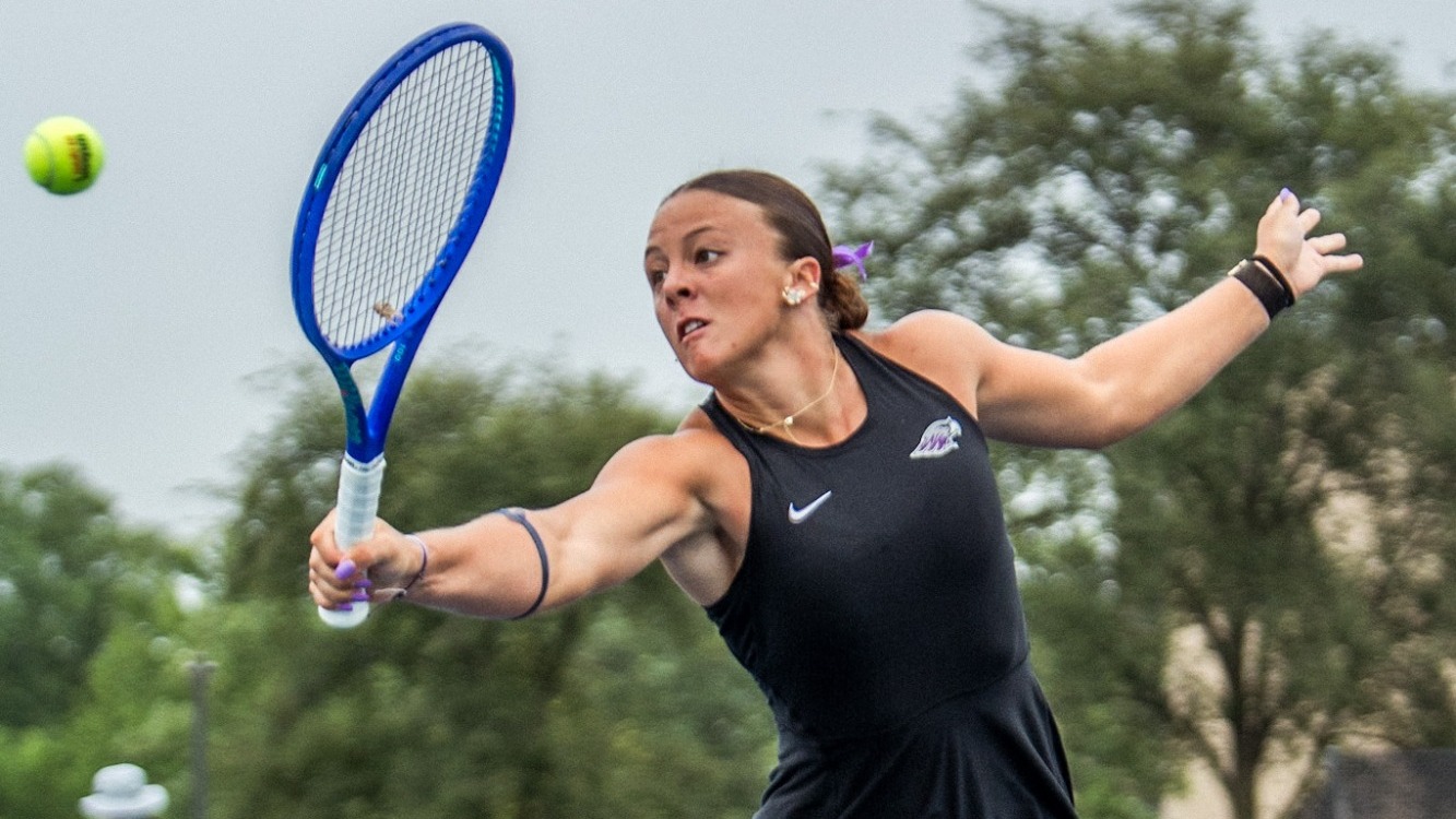 Remke hitting backhand Volley at net