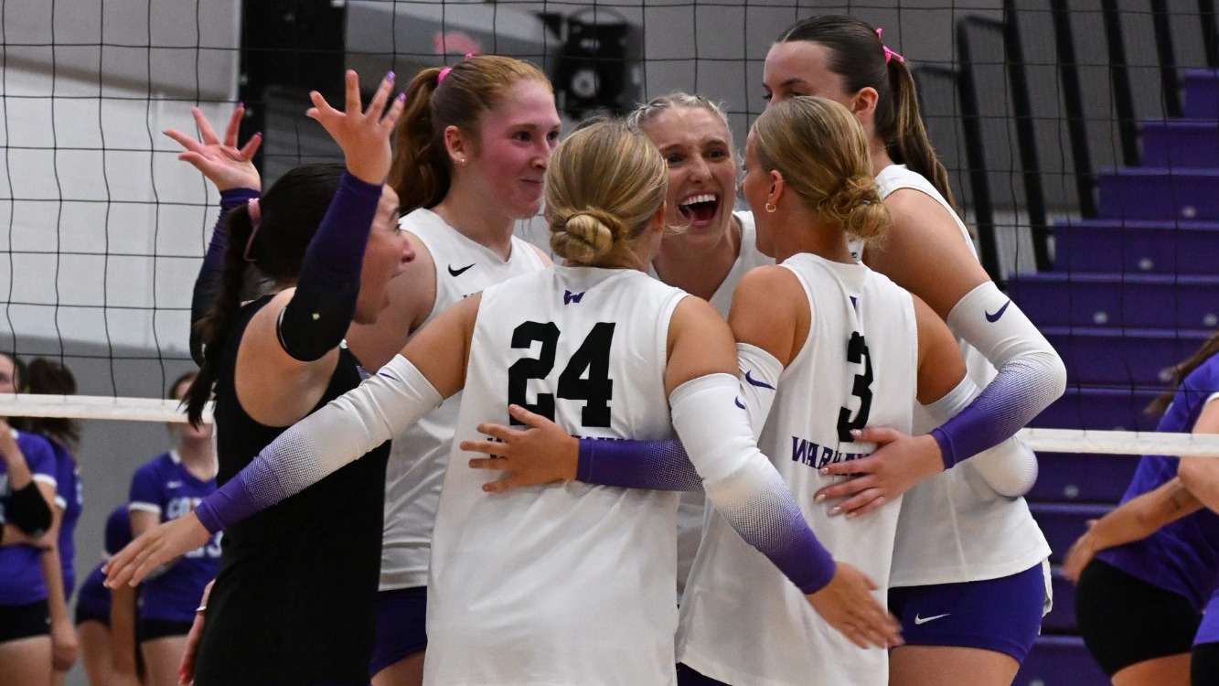 Warhawks huddle after a point