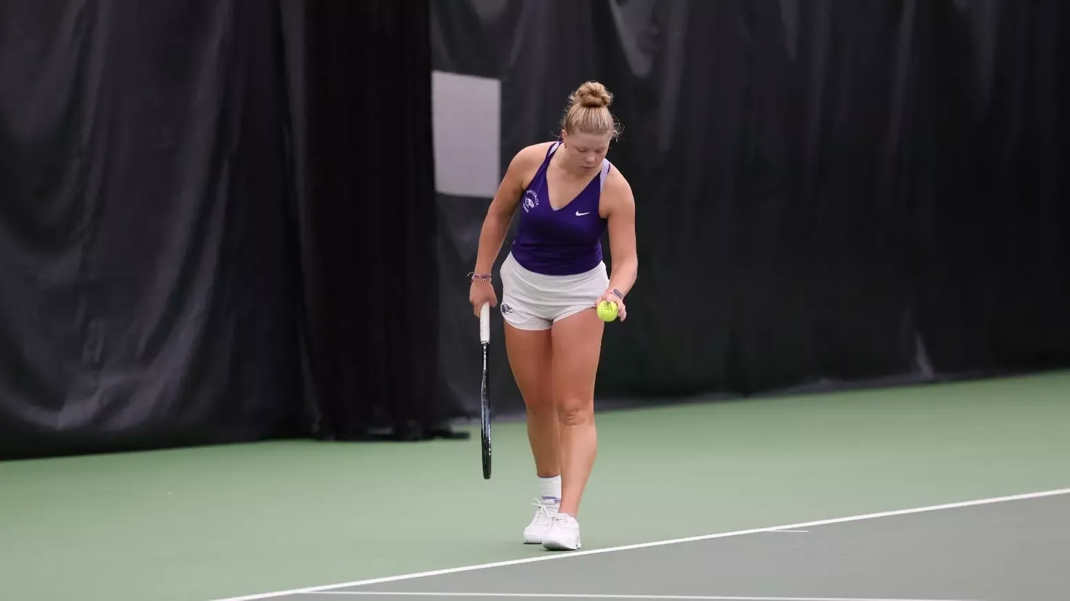 Ashley Adkisson preparing for serve