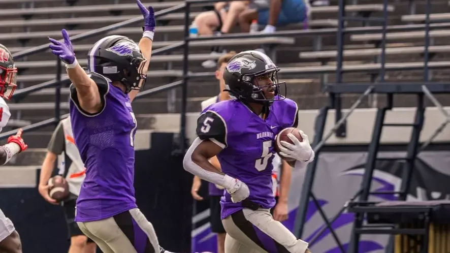 Tommy Novotny cruises into the endzone as Tyler Vasey celebrates