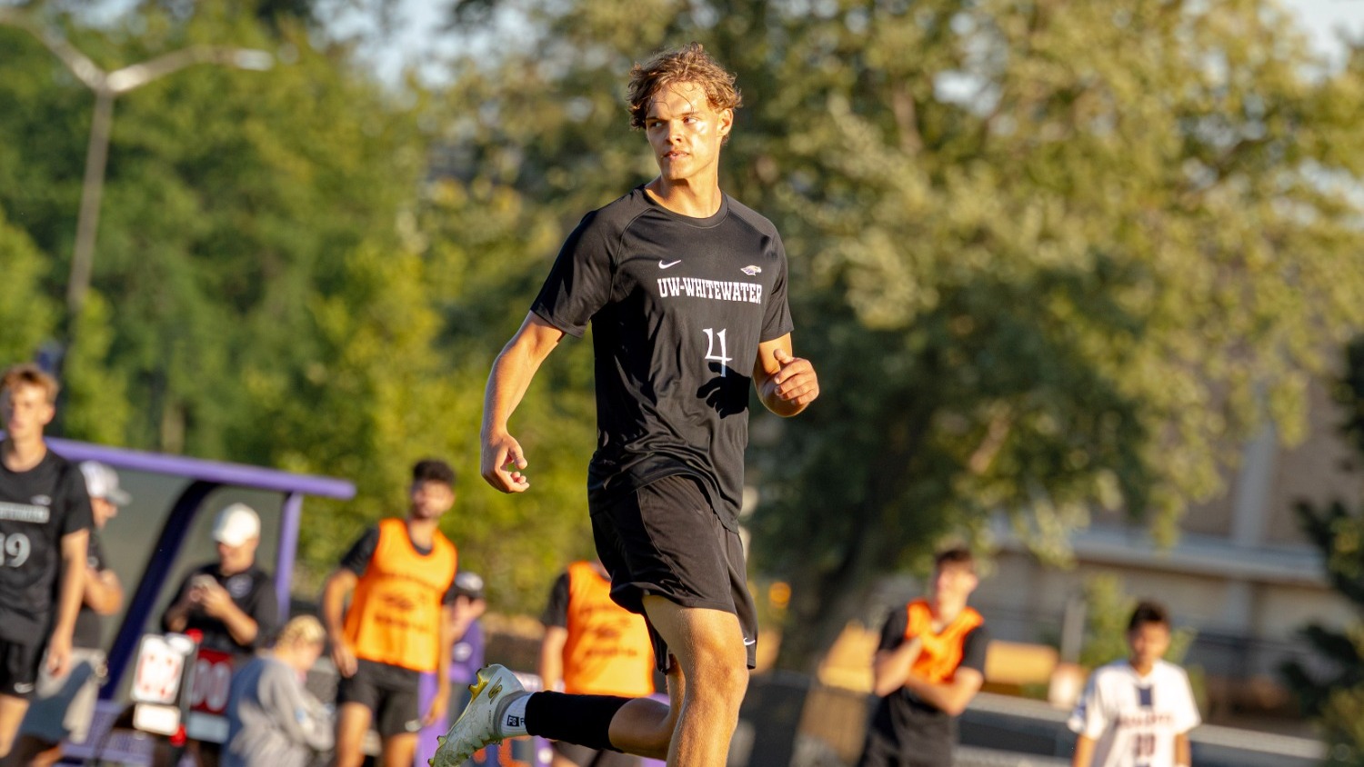 Konrad running up field