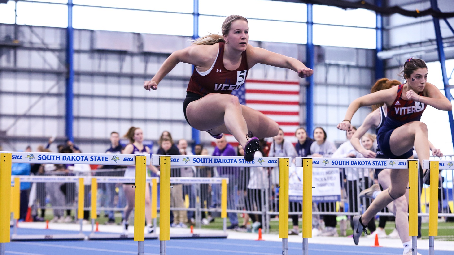 Taylor Sargent clears a hurdle.