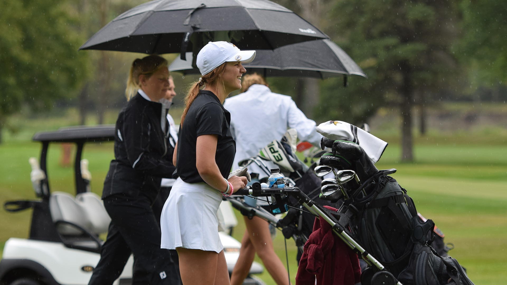 Kathleen Vetter is pictured with her golf bag at the UJ Invite.