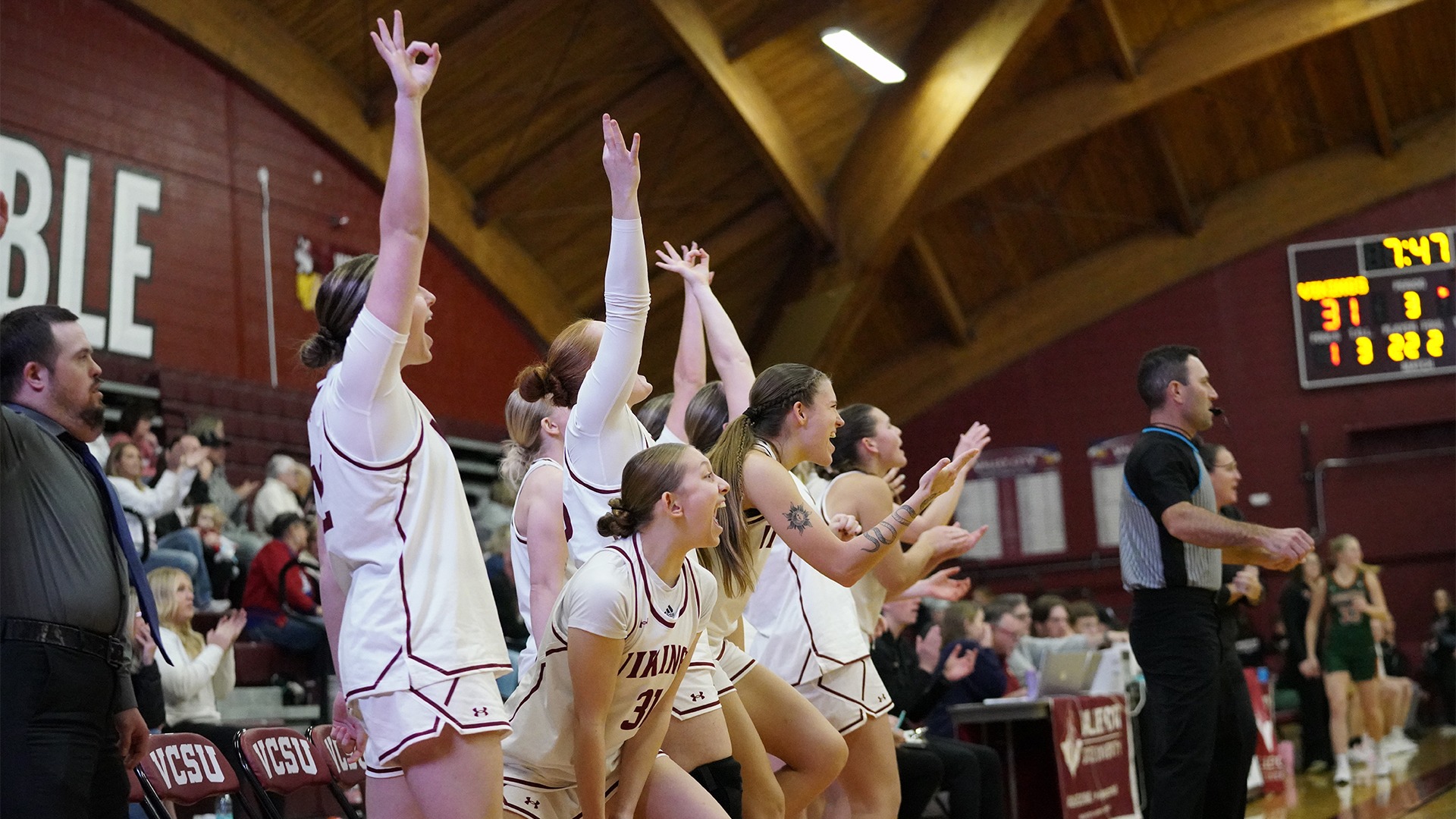 Vikings women's basketball bench reaction.