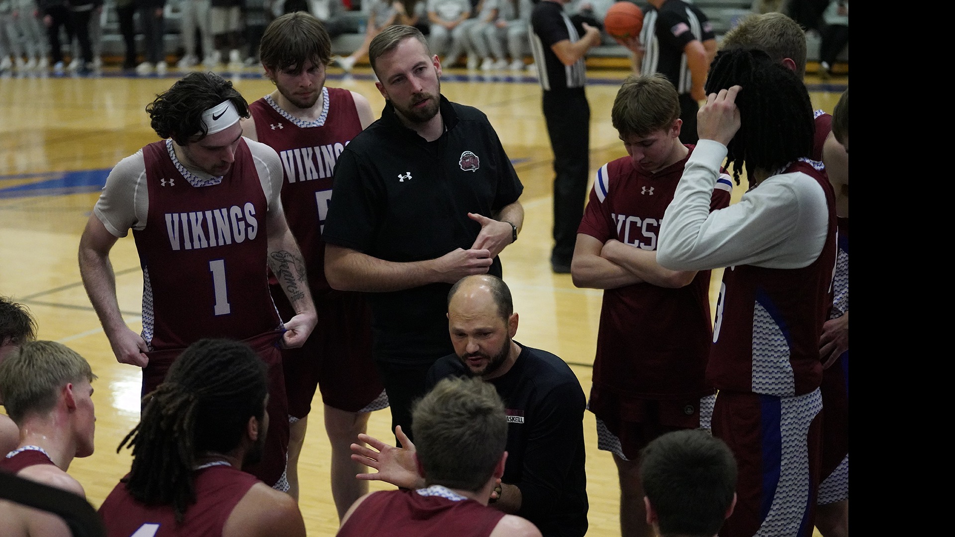 Coach Ryan Montgomery in the huddle