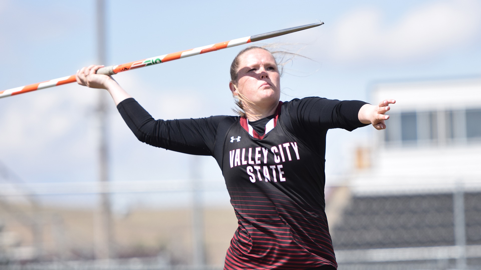 Kendra Odegard throwing javelin.
