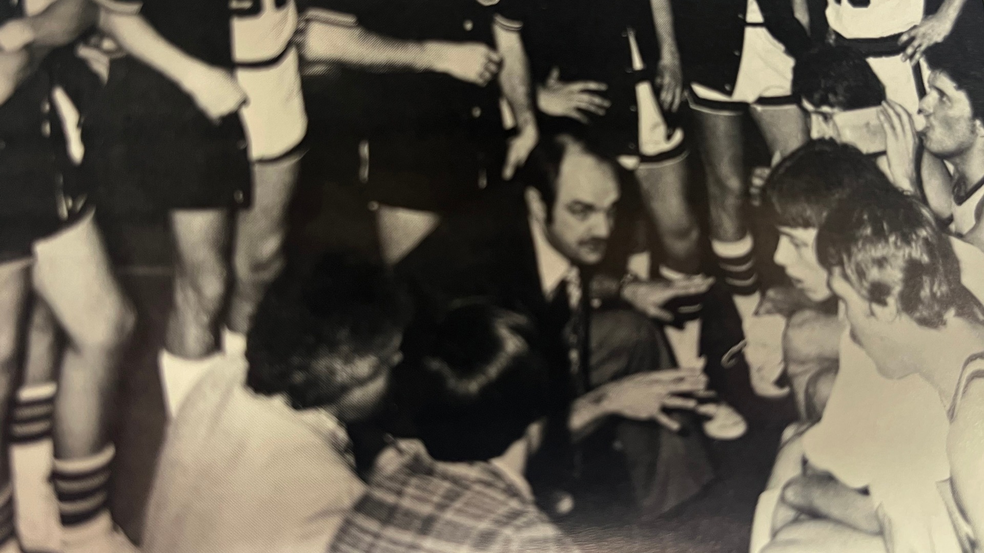 Coach Darrell Anderson giving team instructions