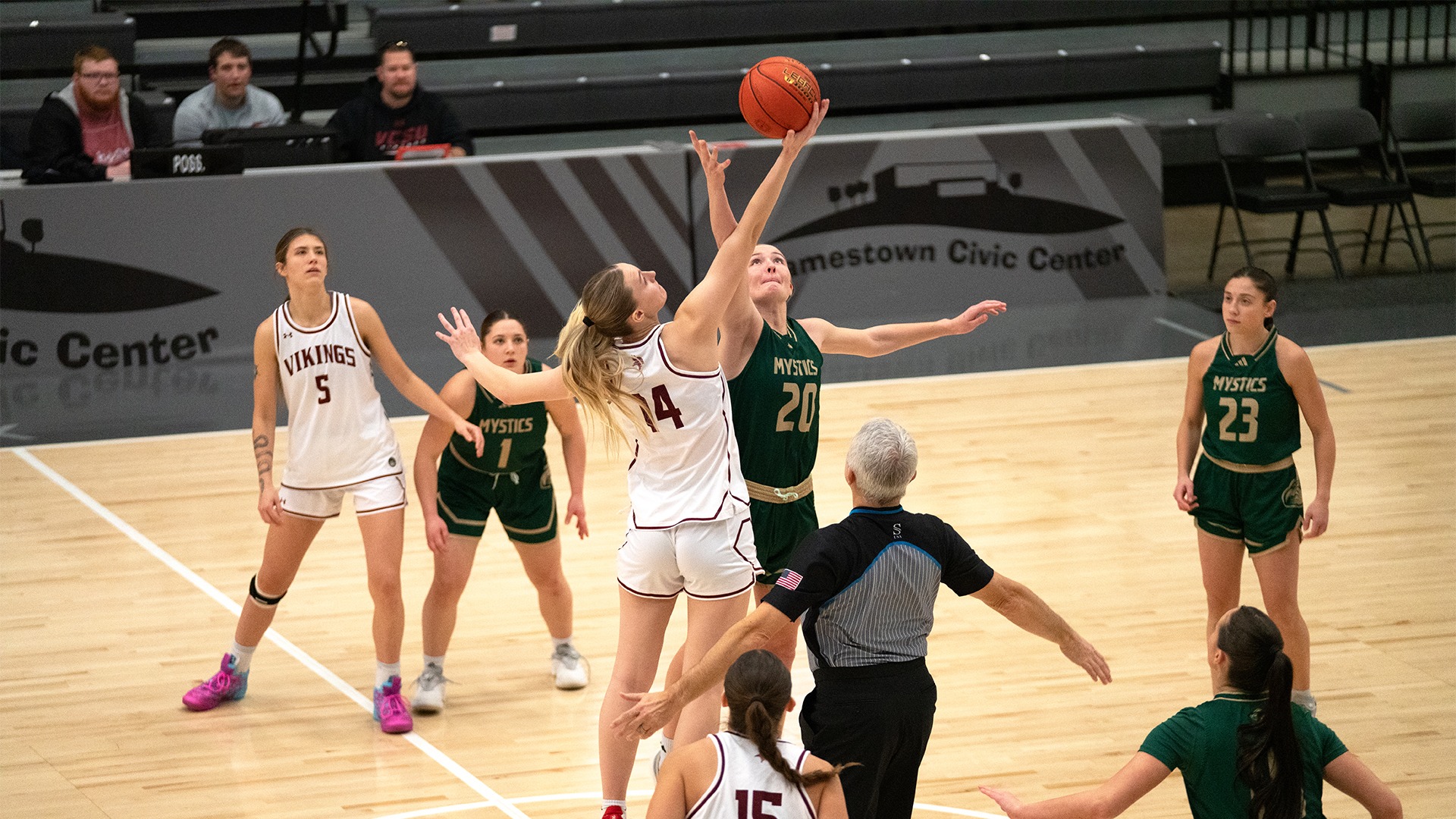 Abby jumps during tipoff against BSC.