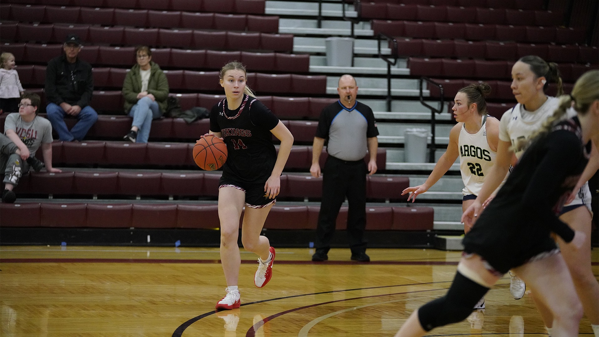 Abby Aslesen dribbles on the perimeter.