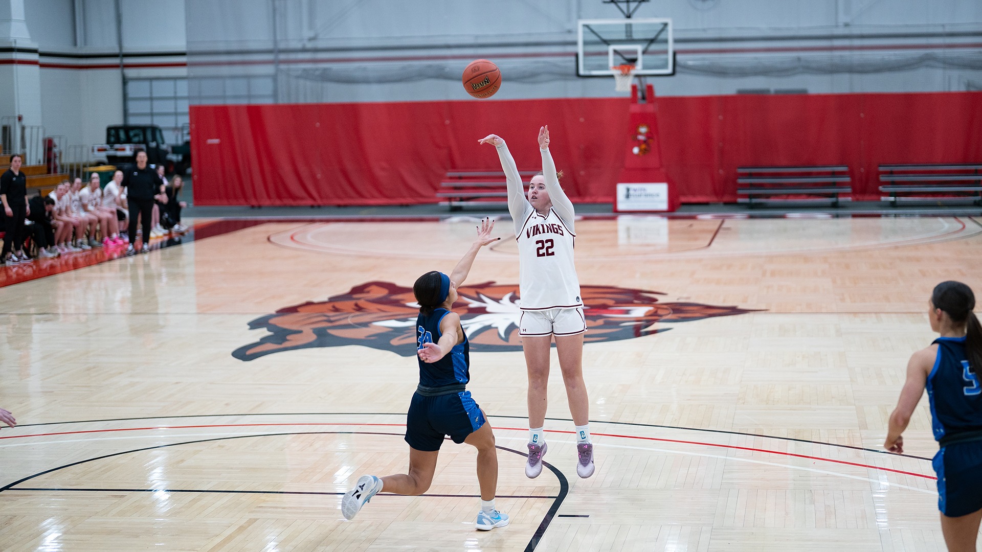 Madison shoots jumpshot.