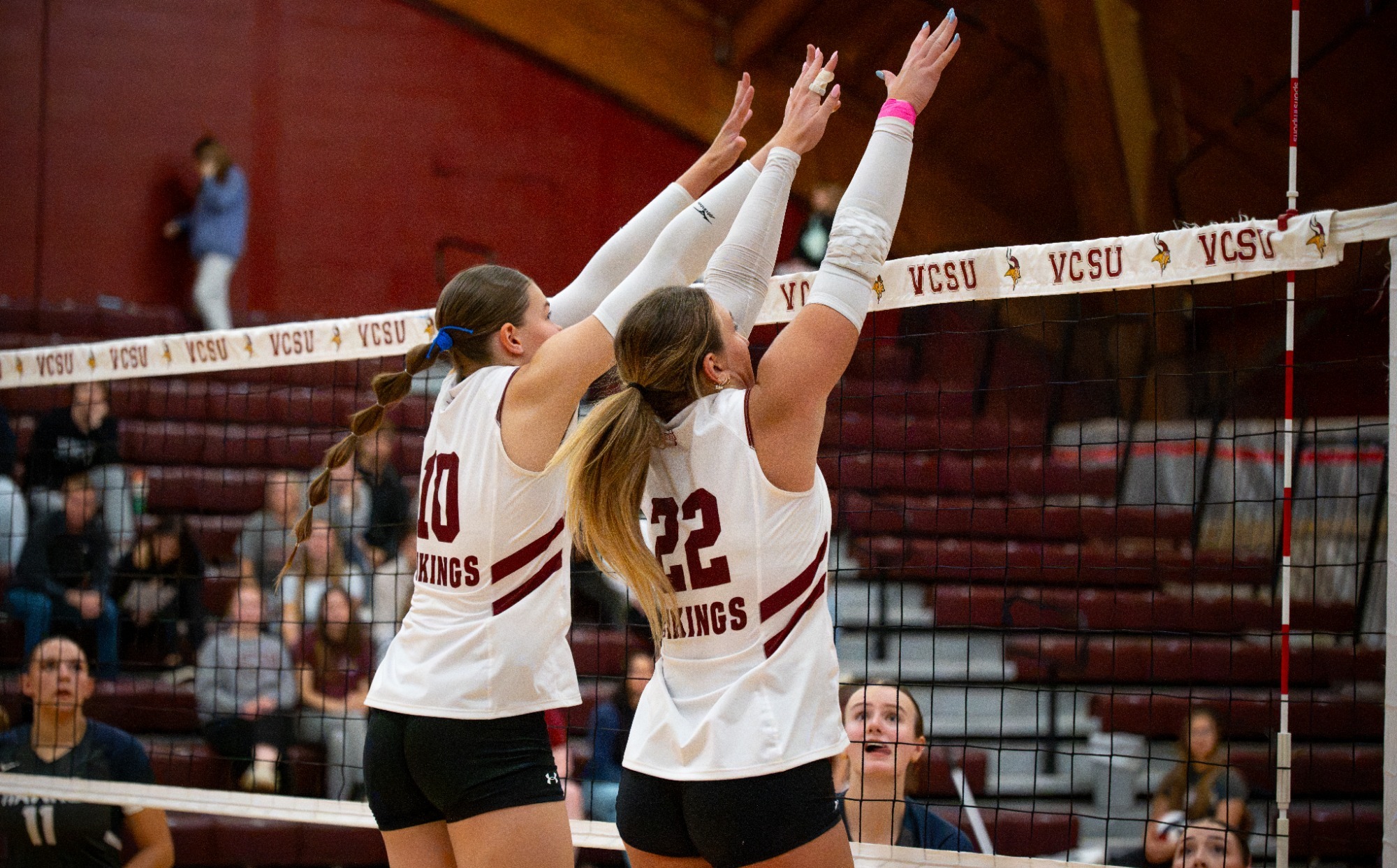 Post-game story- VB vs MSU 2026, Mayden Geist and Madden Bogenreif go up for a block to protect against the attack.