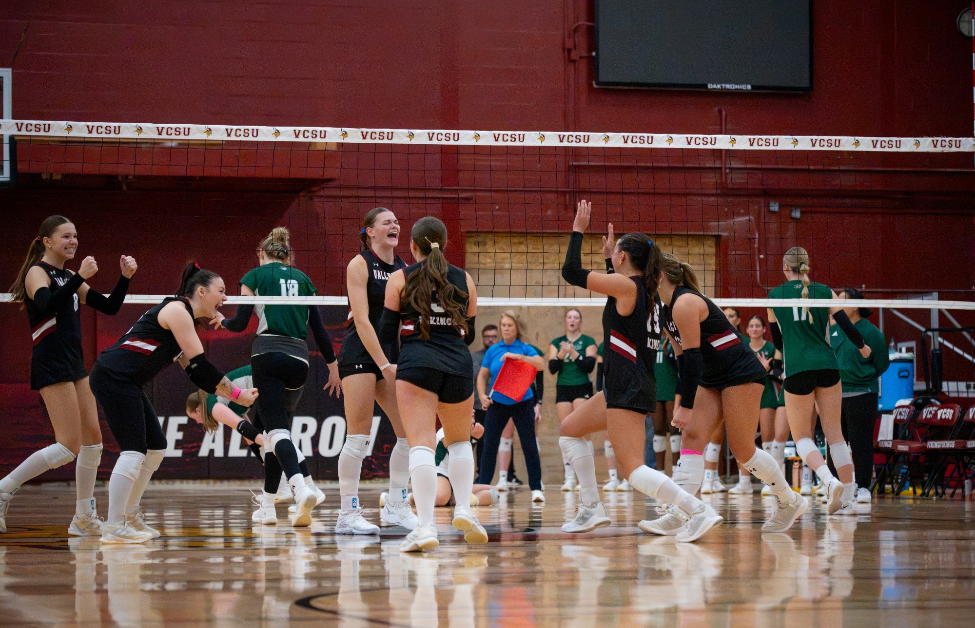 Post-game Story- VB Win over BSC 2026, Vikings burst with excitement after a match tying kill by Madysen Geist. 