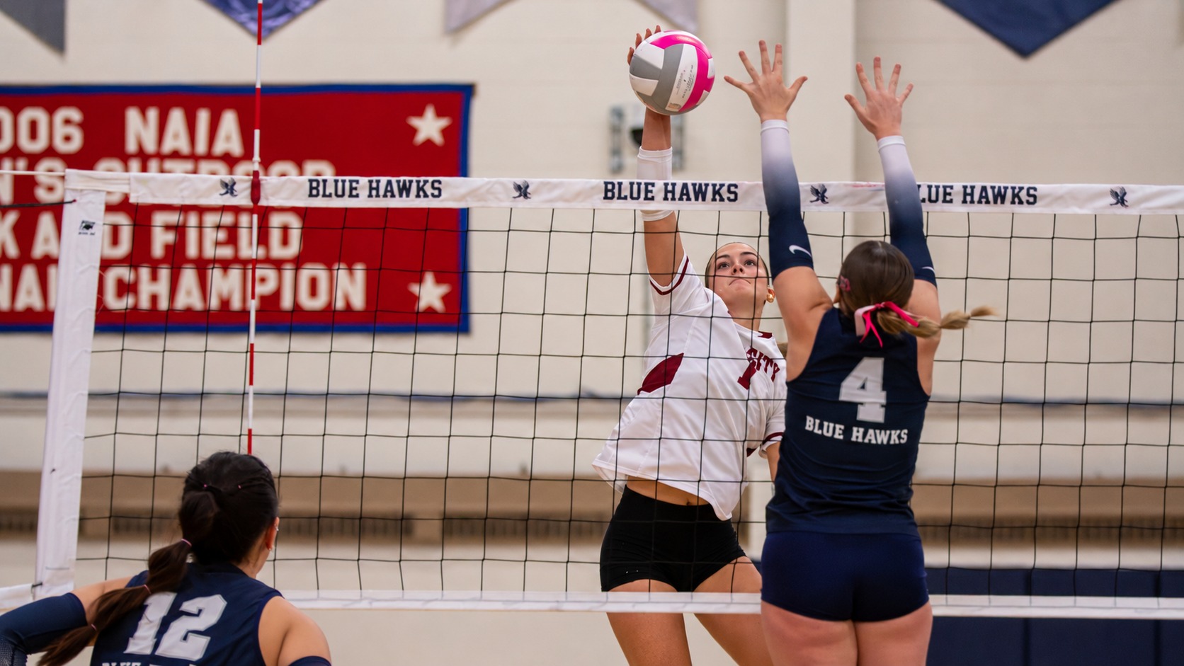 Post-game story- vs. Dickinson St (10-29-2026), Brynn Sorenson goes in for the kill against two blockers from Dickinson State.