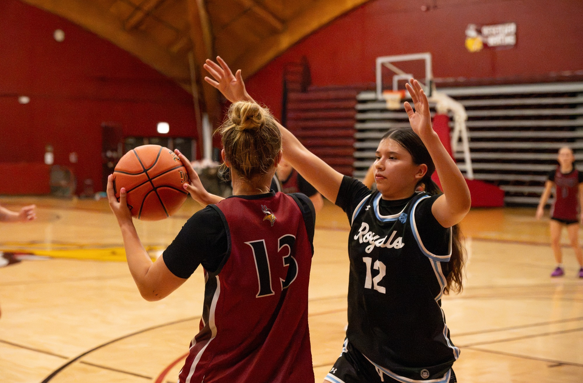 Post game story- vs. Concordia (NE) 2026-27, Aspyn Schlect tries to find an open teammate while being guarded by a Lake Region player.