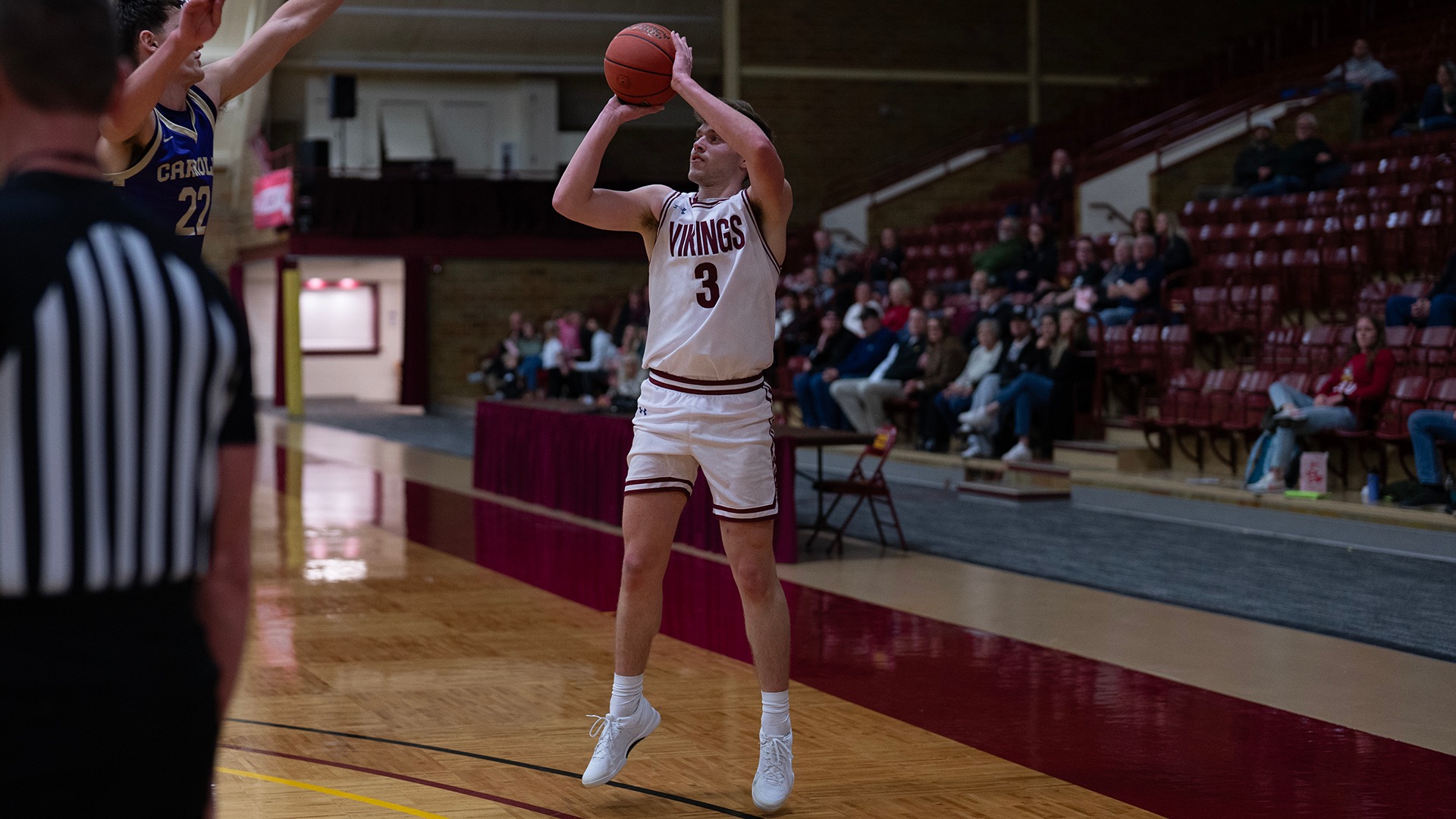 Kaleb Larson takes a shot against Carroll