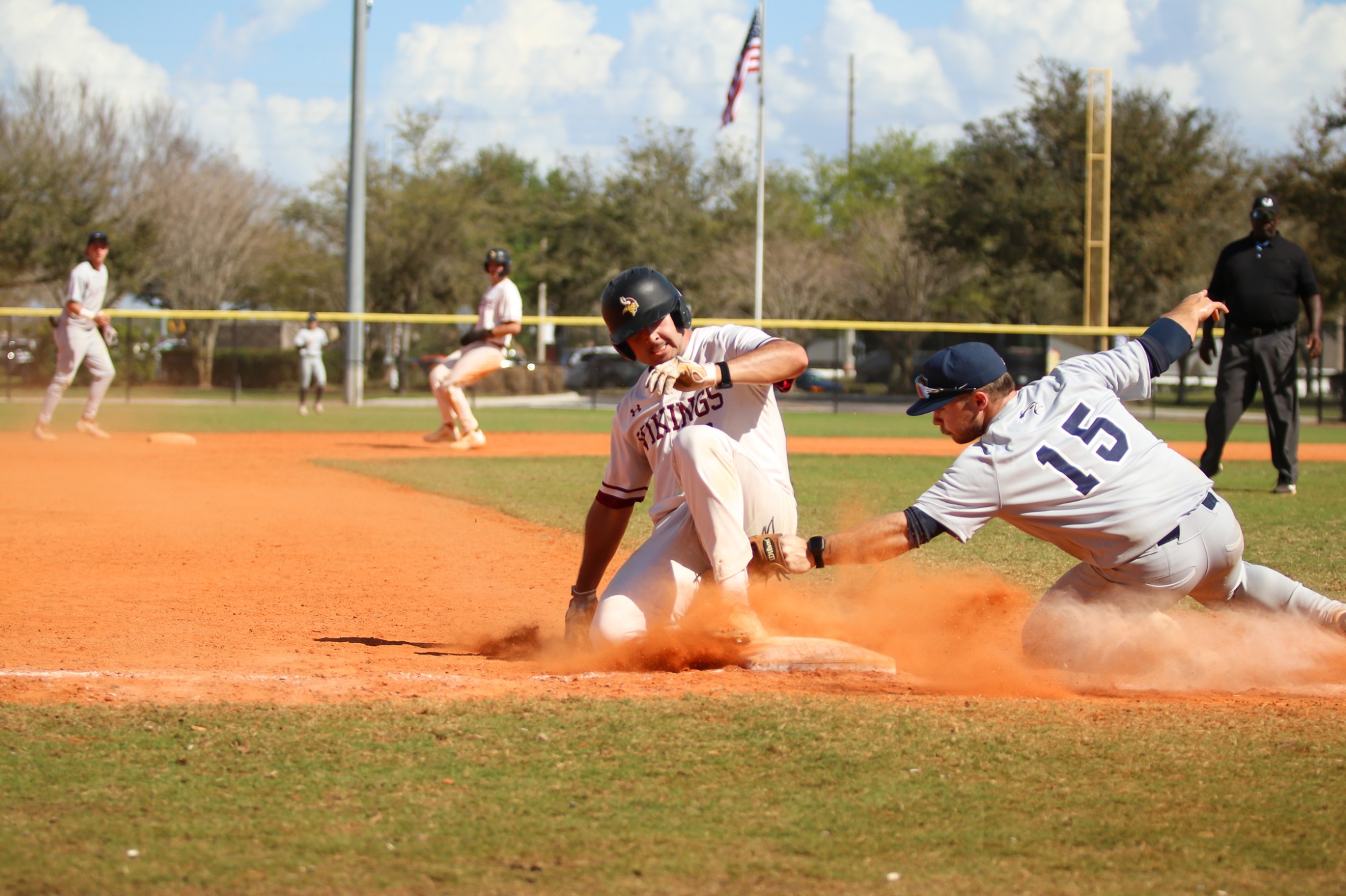 VCSU Baseball player sliding into 3rd.