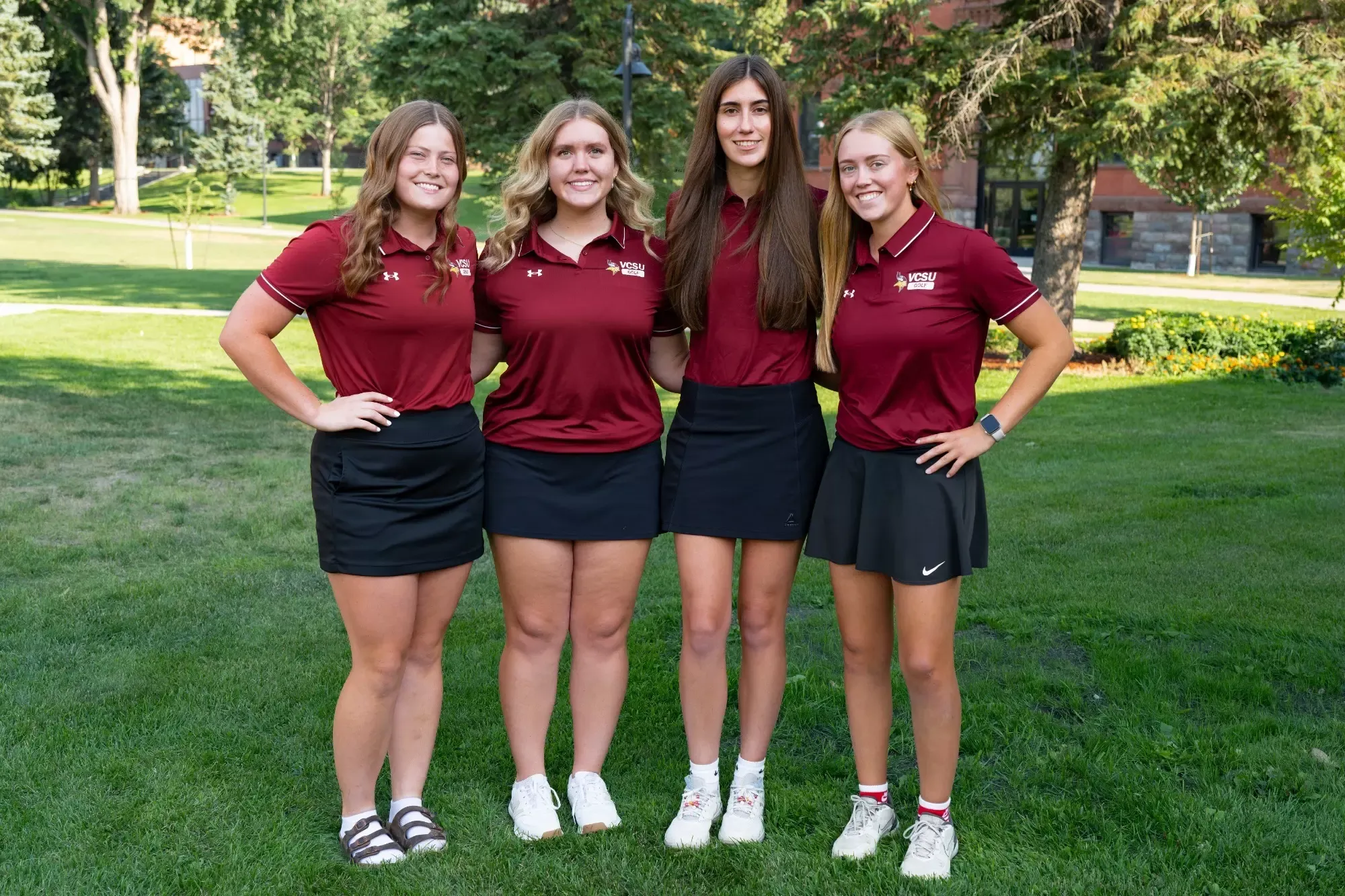 The VCSU women’s golf team poses together and smiles for its official team photo.