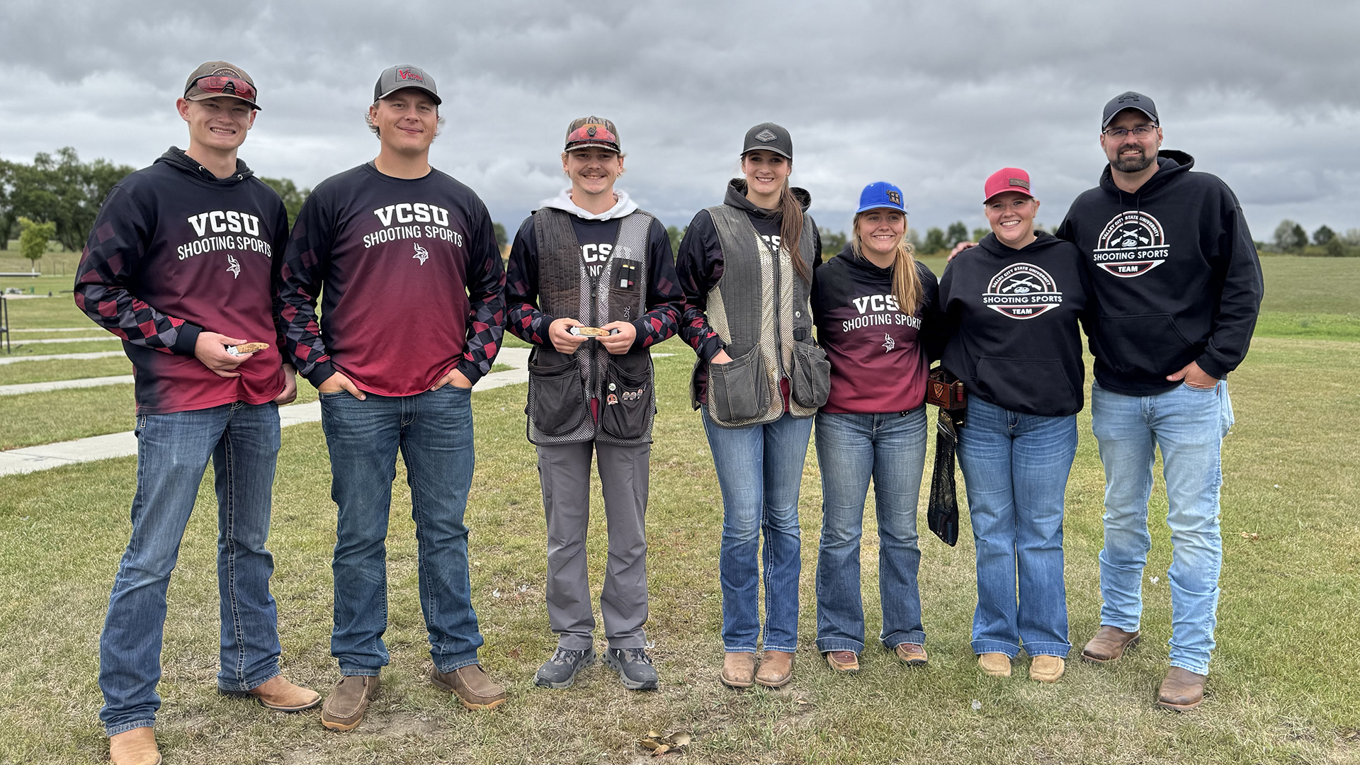 2026 Shooting Sports Tournament 1- Shooting sport's team pose together after tournament with awards.