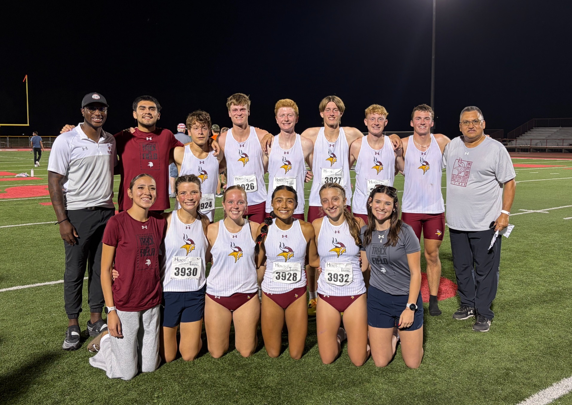 Cross Country Story Photo- Auggie Invite: Cross country team poses after finishing their race at the Twilight Invitational. 