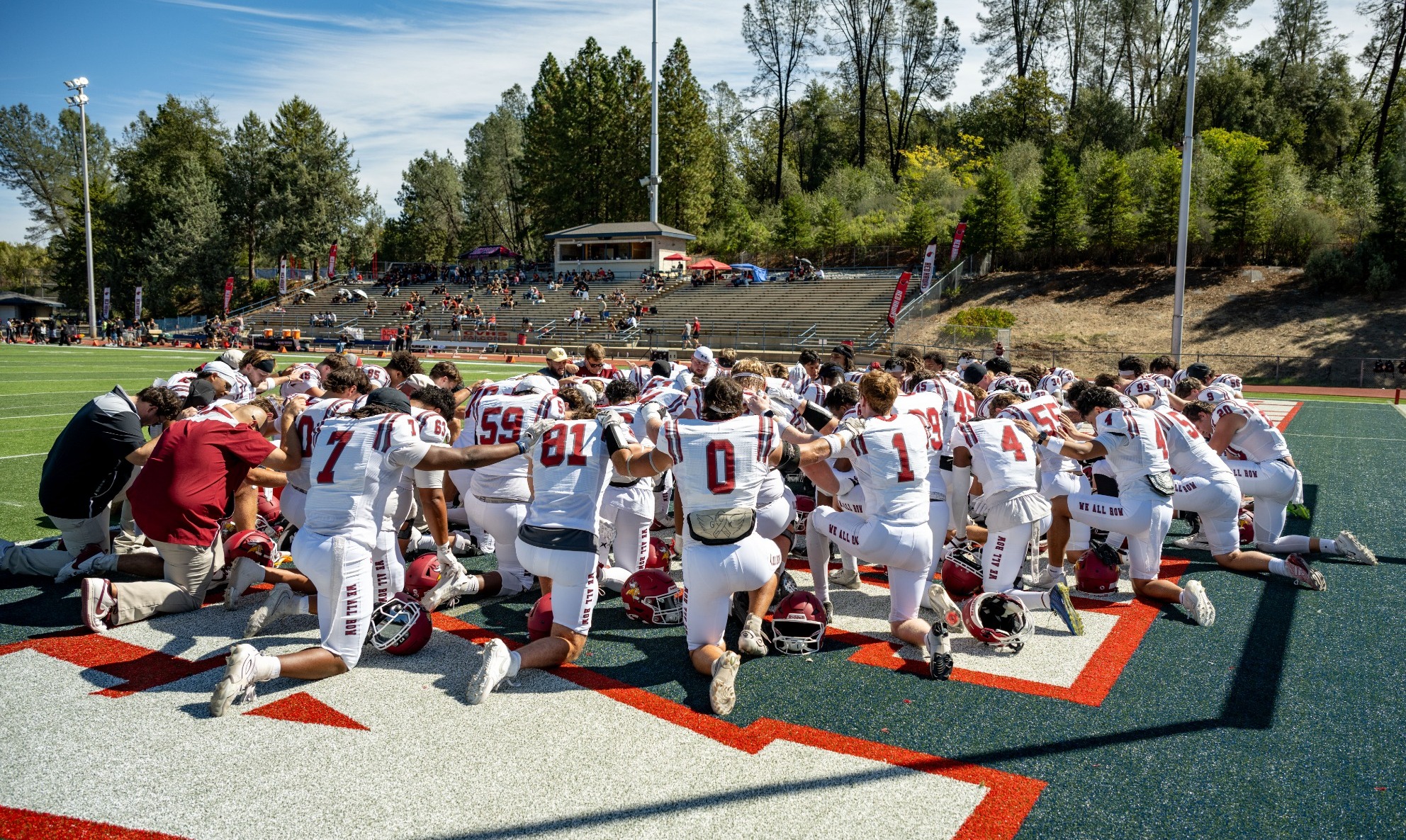 Pre-game prayer before the game against Simpson in California 