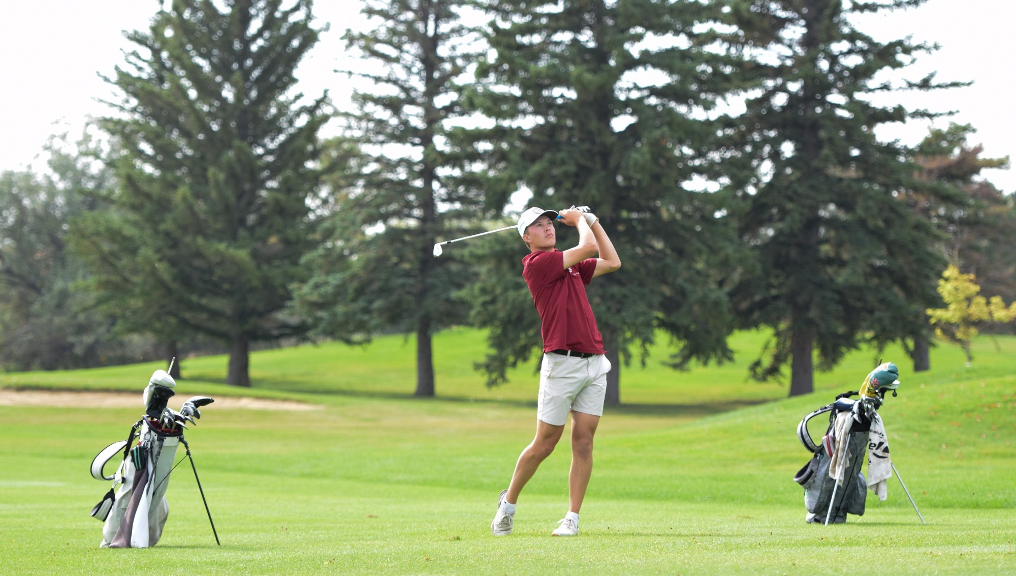 Owen Haase tees off with a big drive at 2025 frontier conference tournament. 