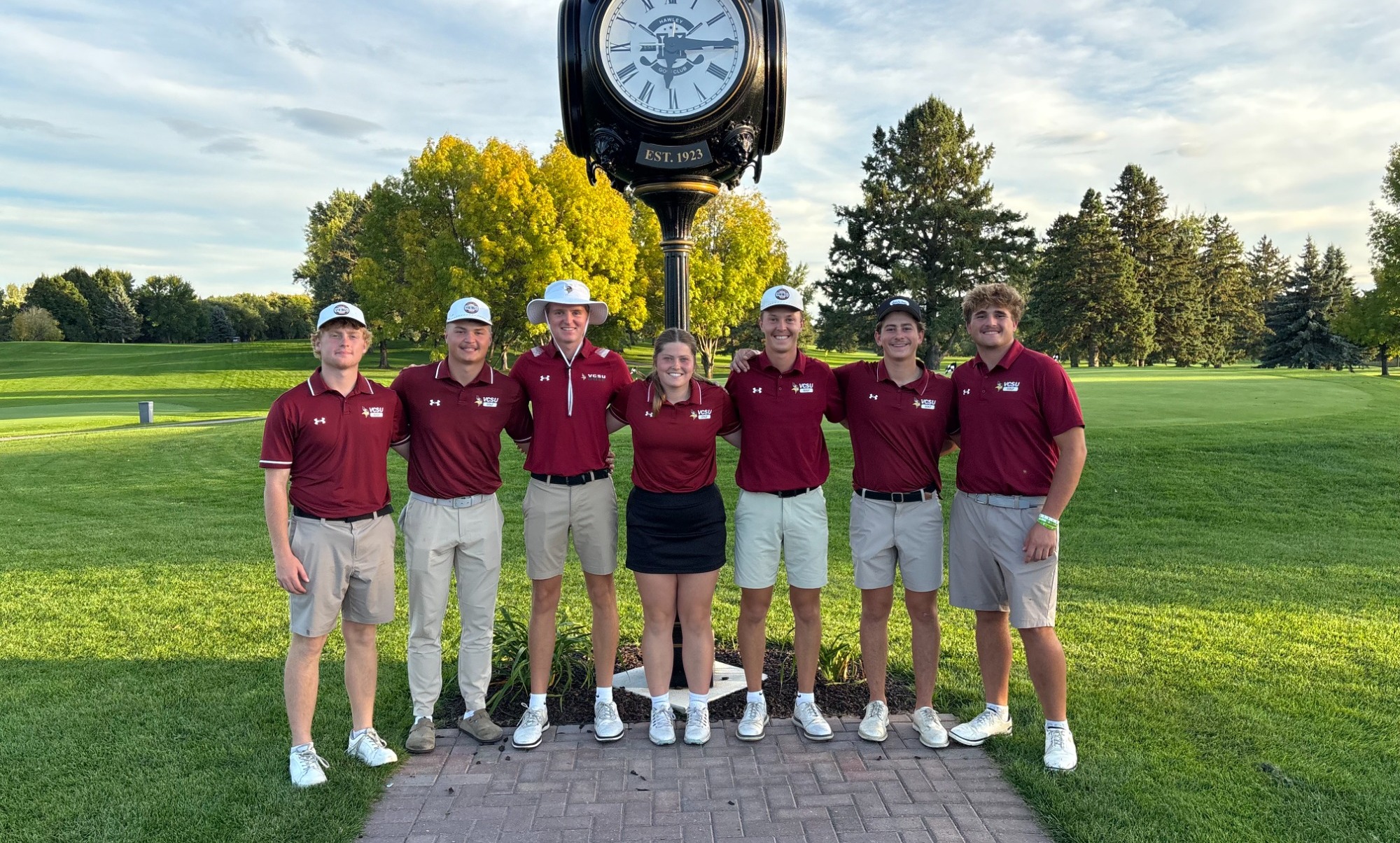 VCSU Golf Hawley Tournament 2026 - The men's golf team and Sadie Neustel pose after a successful day on the course.