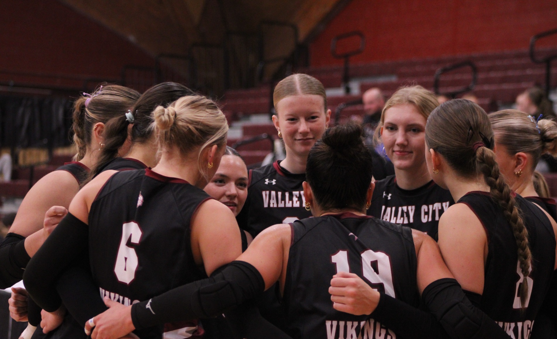 Pre-game story Dickinson/Bismarck VB 2026- VCSU Volleyball huddles together during Carroll match.