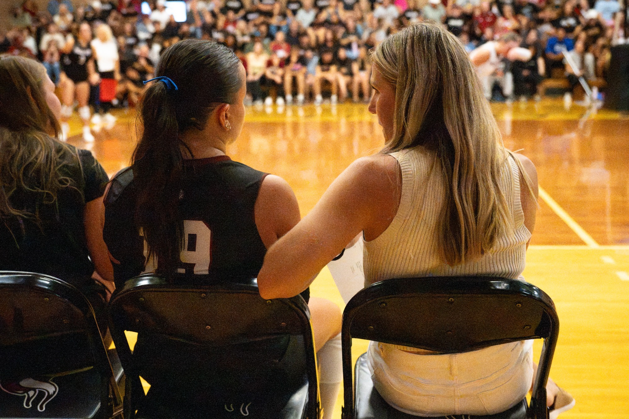 Coach/Player Convo- Head Coach Meiklejohn discusses the game with senior, setter Gracie Schumacher.