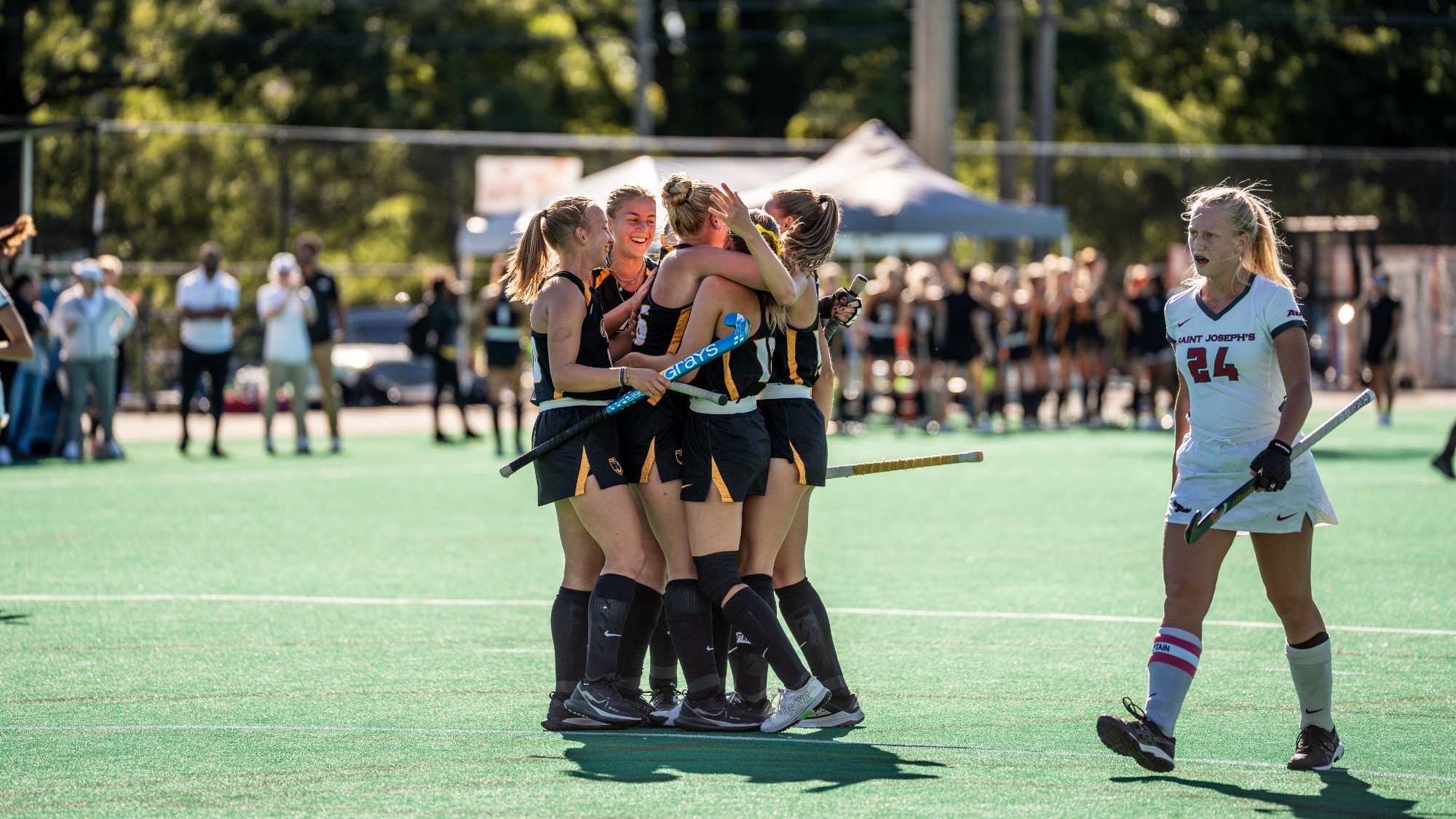 VCU Field Hockey team celebrates a goal in a team huddle after scoring a goal against Saint Joseph's