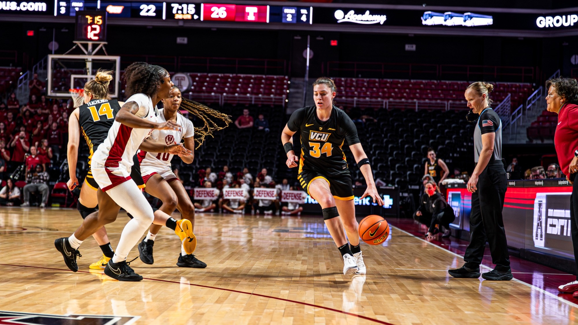 Katarina Kneževic of VCU wearing a black #34 jersey dribbles the ball in a game against Temple