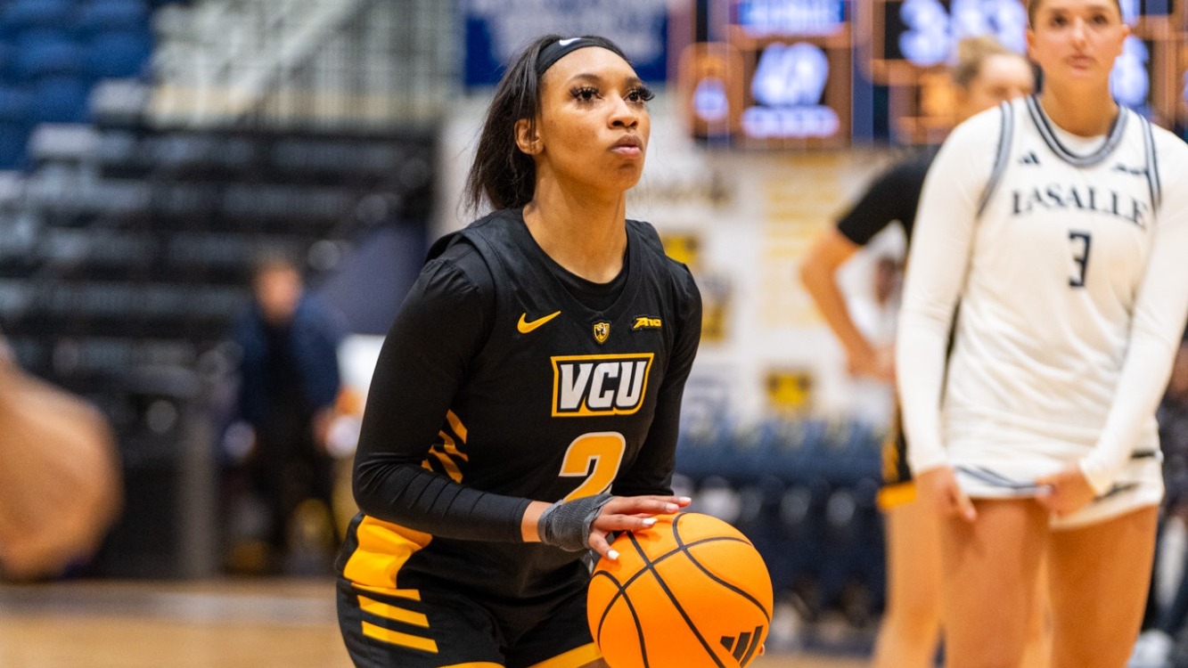 Cyriah Griffin of VCU wearing a black #2 jersey goes to shoot a free throw against La Salle