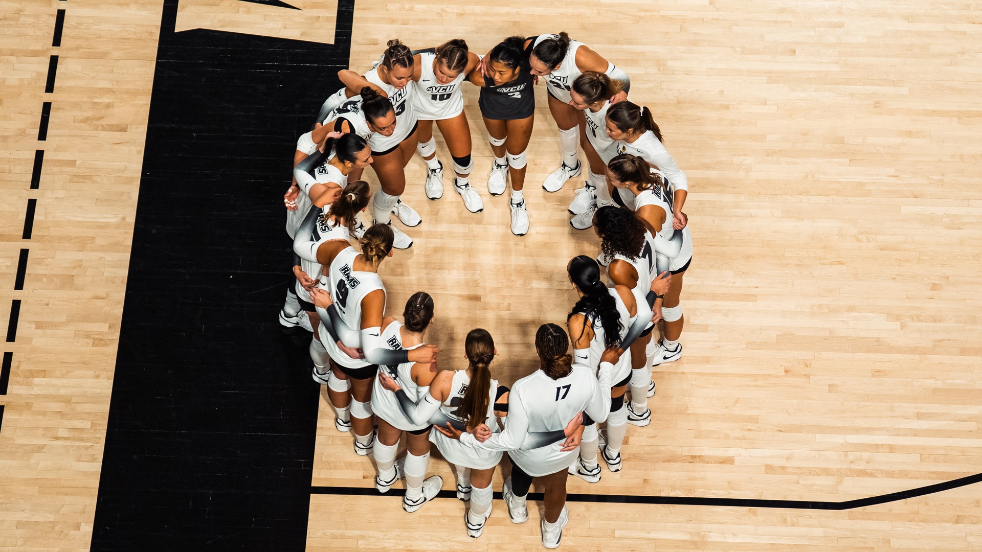 Volleyball team huddle from above 2025