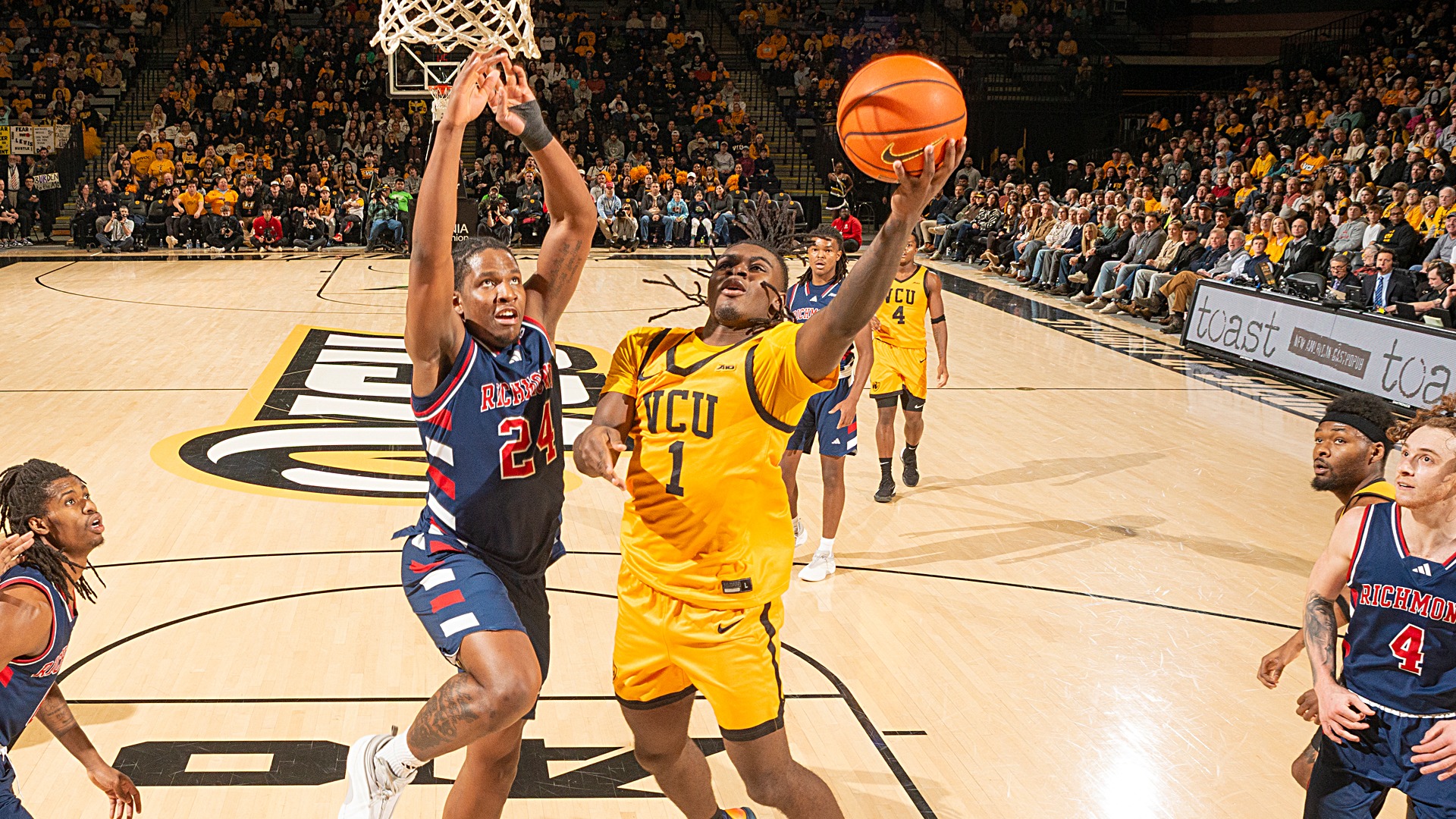 Nyk Lewis drives vs. Richmond