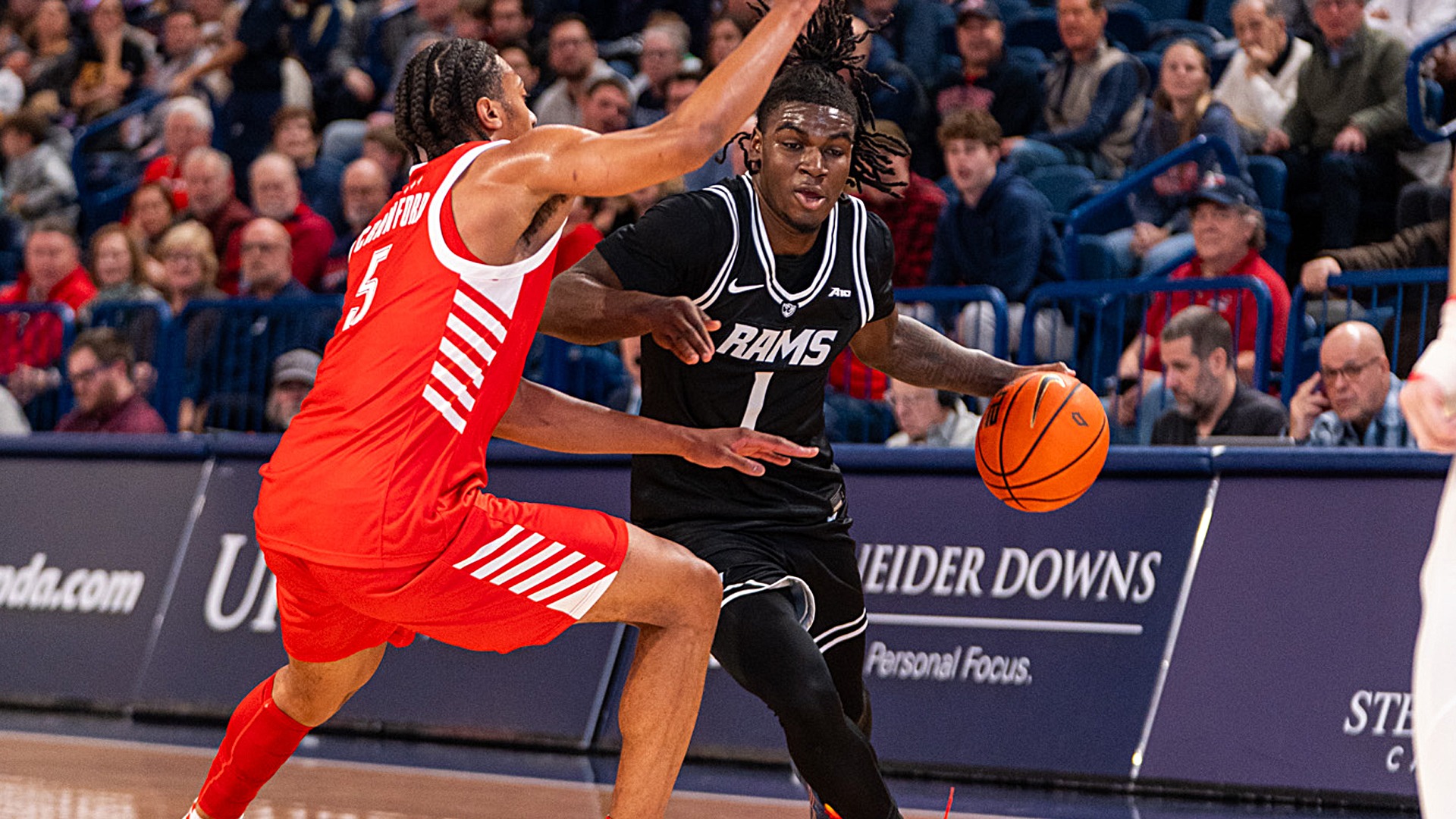 Nyk Lewis drives on Duquesne