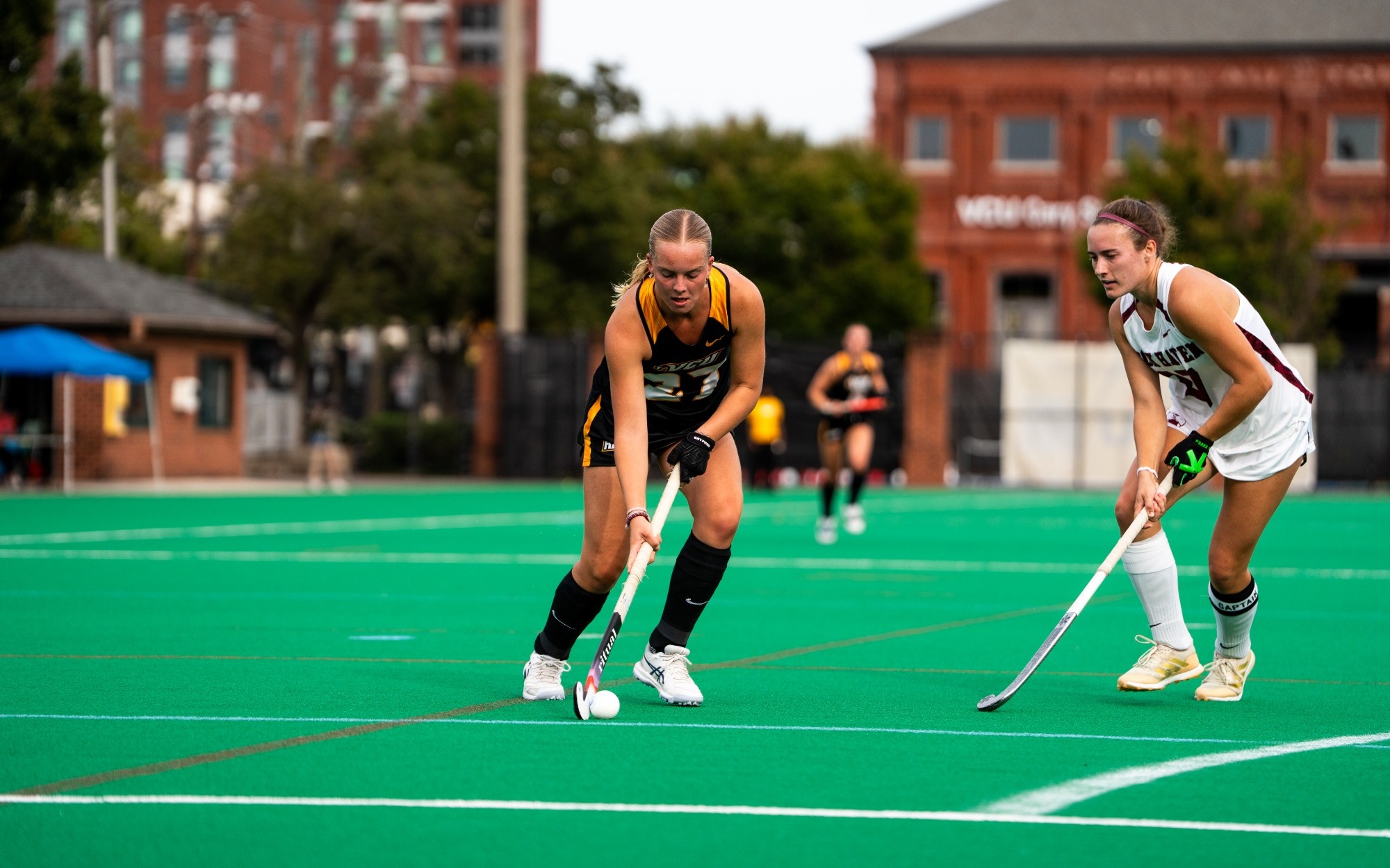 Julia Spohr of VCU wearing a black #27 uniform dribbles the ball unguarded in a game against Lock Haven